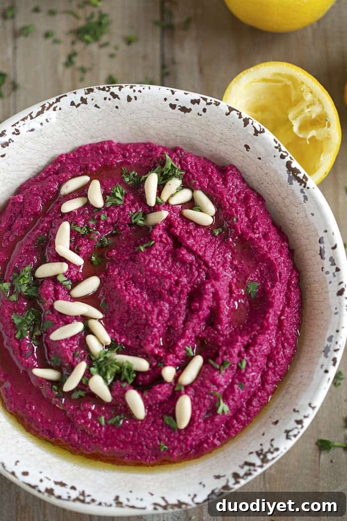 This Creamy Roasted Beet Hummus is gluten-free, dairy-free, vegan and a FAVORITE in our house! eat-yourself-skinny.com
