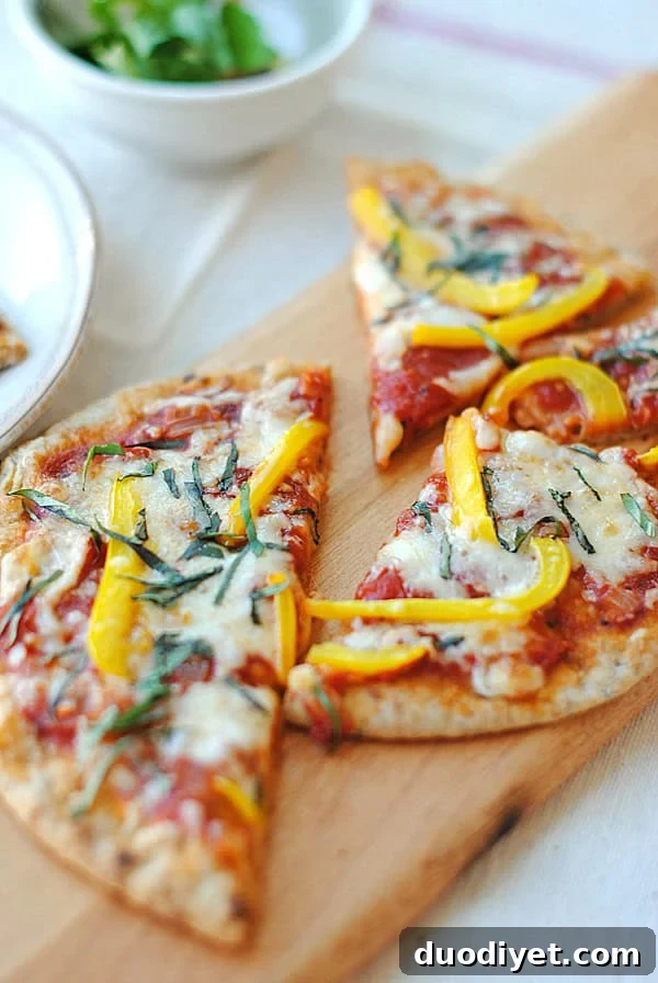 Sliced pita pizza with basil