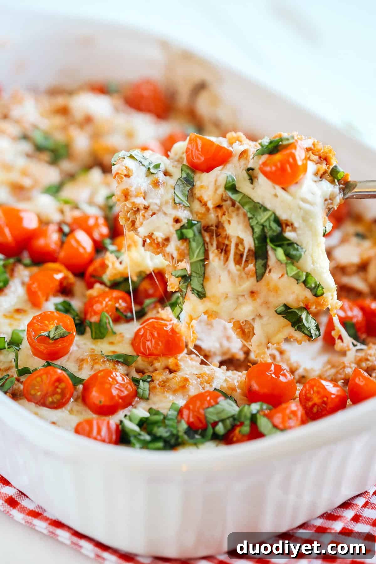 Baked Caprese Chicken and Quinoa Casserole Recipe 4 This super flavorful Cheesy Caprese Chicken and Quinoa Casserole is the perfect weeknight meal that is hearty, full of flavor and sure to please the entire family!