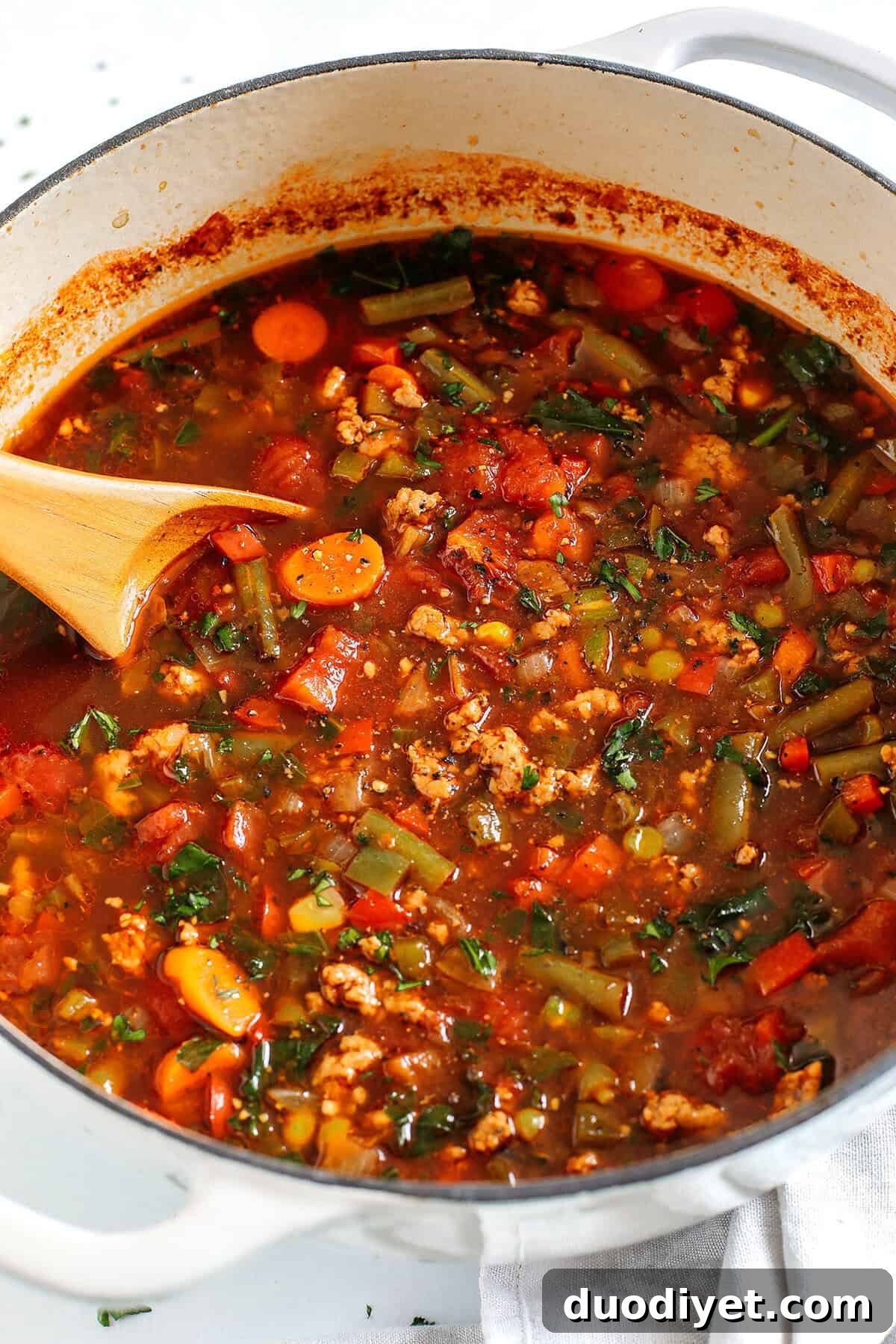 This One Pot Spicy Sausage and Kale Soup is hearty, loaded with a variety of vegetables and leafy kale, all simmered in flavorful beef broth, diced tomatoes and yes, a whole jar of salsa!
