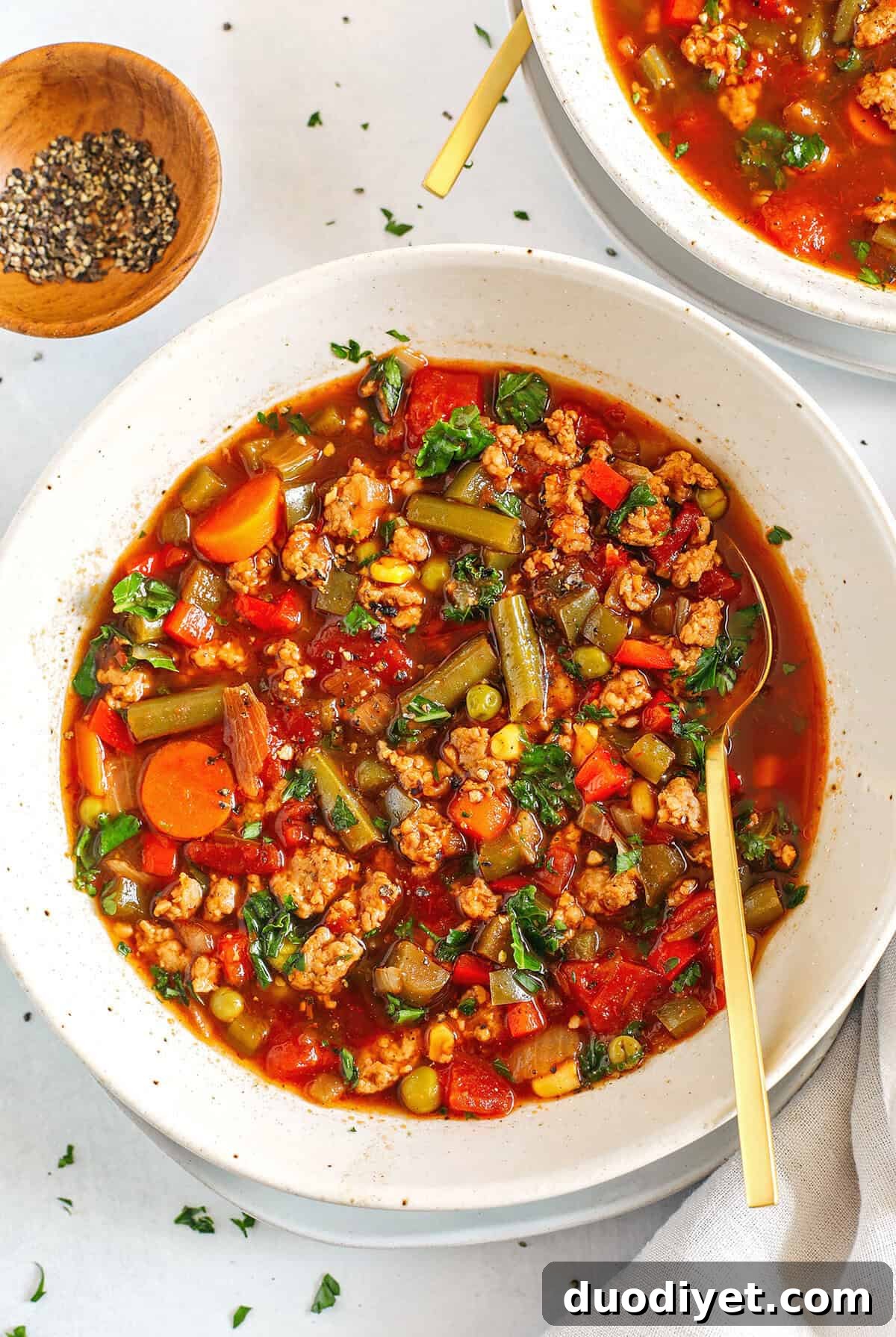 This One Pot Spicy Sausage and Kale Soup is hearty, loaded with a variety of vegetables and leafy kale, all simmered in flavorful beef broth, diced tomatoes and yes, a whole jar of salsa!