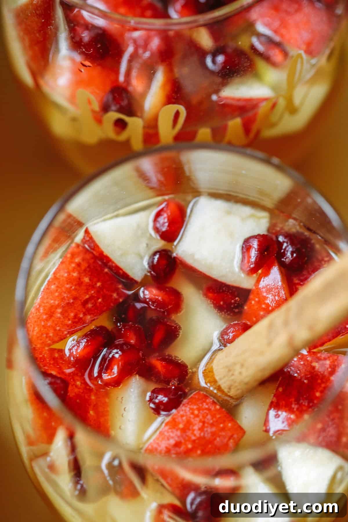 Autumn Harvest Sangria Recipe with Apples, Pears and Cinnamon 5 Sliced apples and pears for sangria