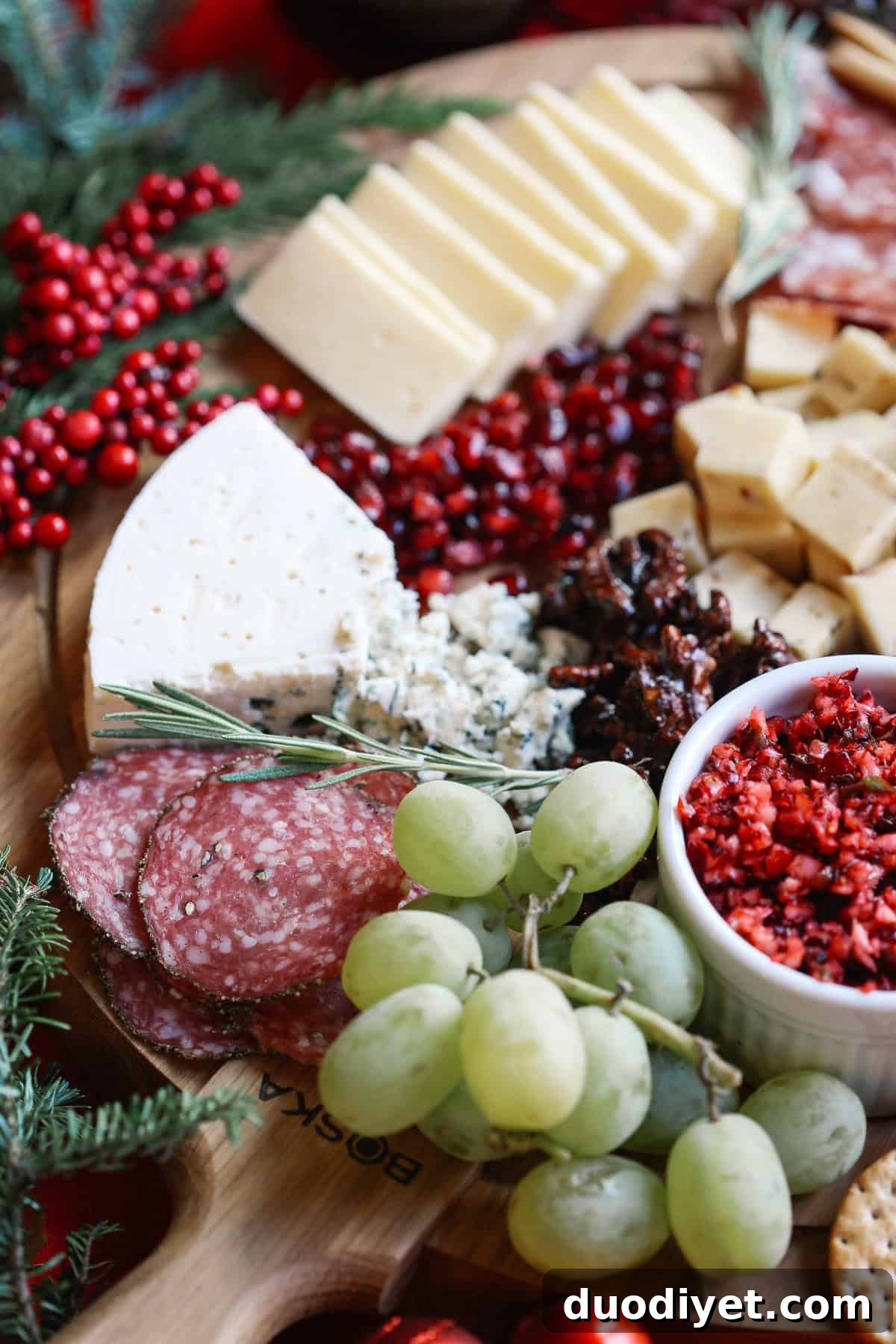 Holiday Cheese Board: Guide to Assembling a Stunning Spread 3 Assorted cheeses and accompaniments on a holiday board
