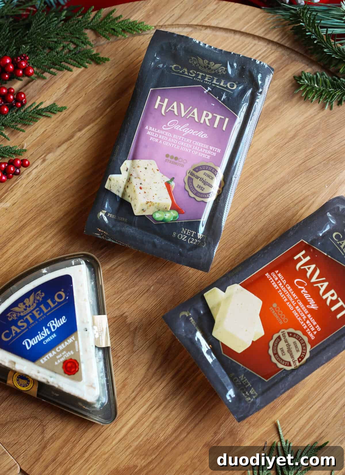 Holiday Cheese Board: Guide to Assembling a Stunning Spread 4 Cheeses cut in different shapes for a board