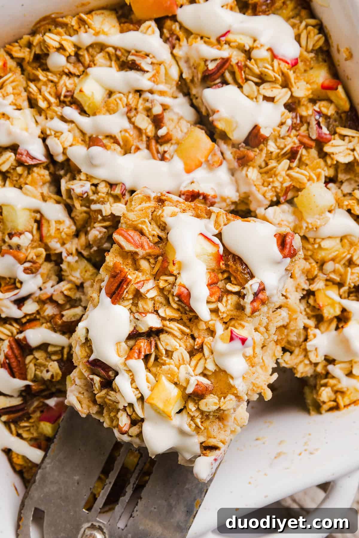 Apple Cinnamon Baked Oatmeal Recipe for Cozy Mornings 2 This Apple Cinnamon Baked Oatmeal is a cozy breakfast made with wholesome oats, shredded apples, and warm spices while naturally sweetened with maple syrup and plump raisins! We also topped this with crunchy pecans and a delicious maple cream cheese glaze!