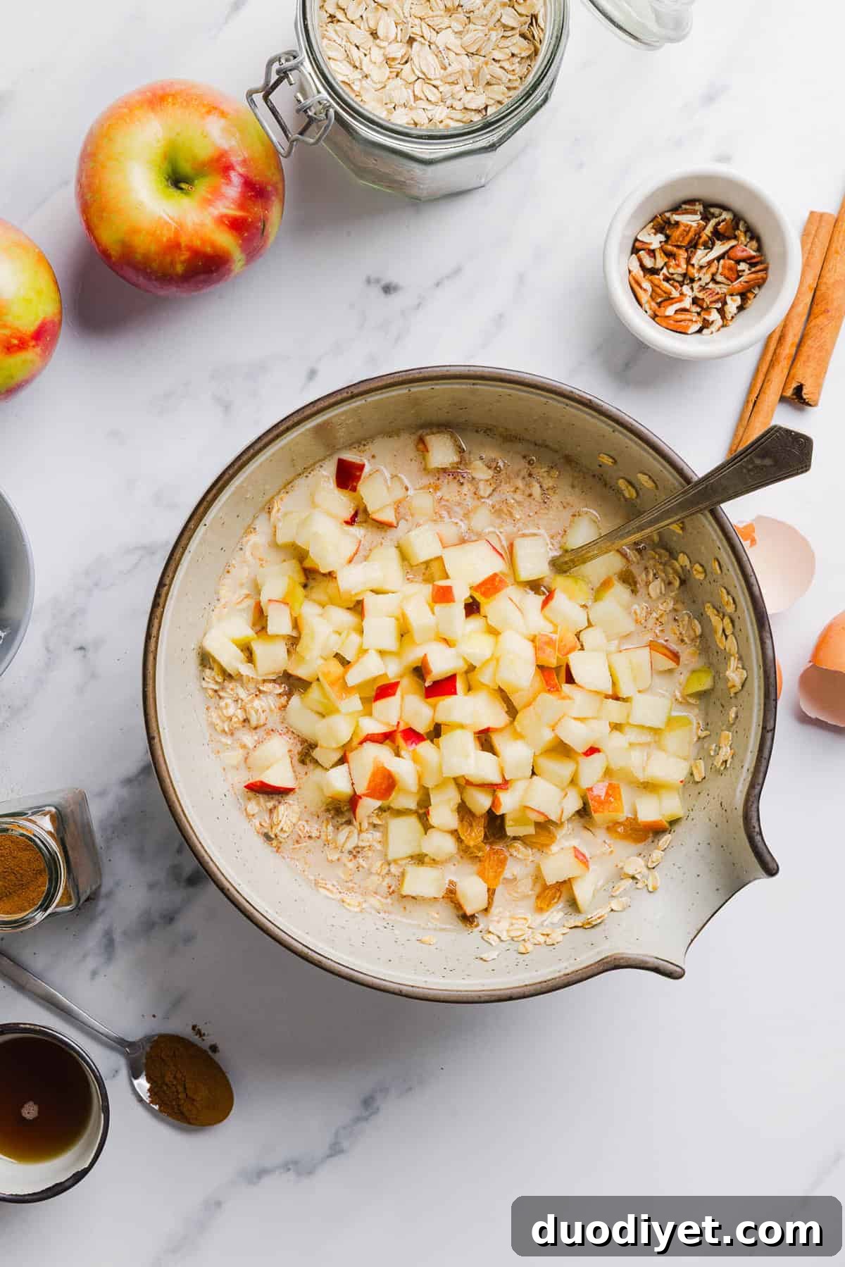 Apple Cinnamon Baked Oatmeal Recipe for Cozy Mornings 3 Apple Cinnamon Baked Oatmeal topped with pecans and maple cream cheese glaze
