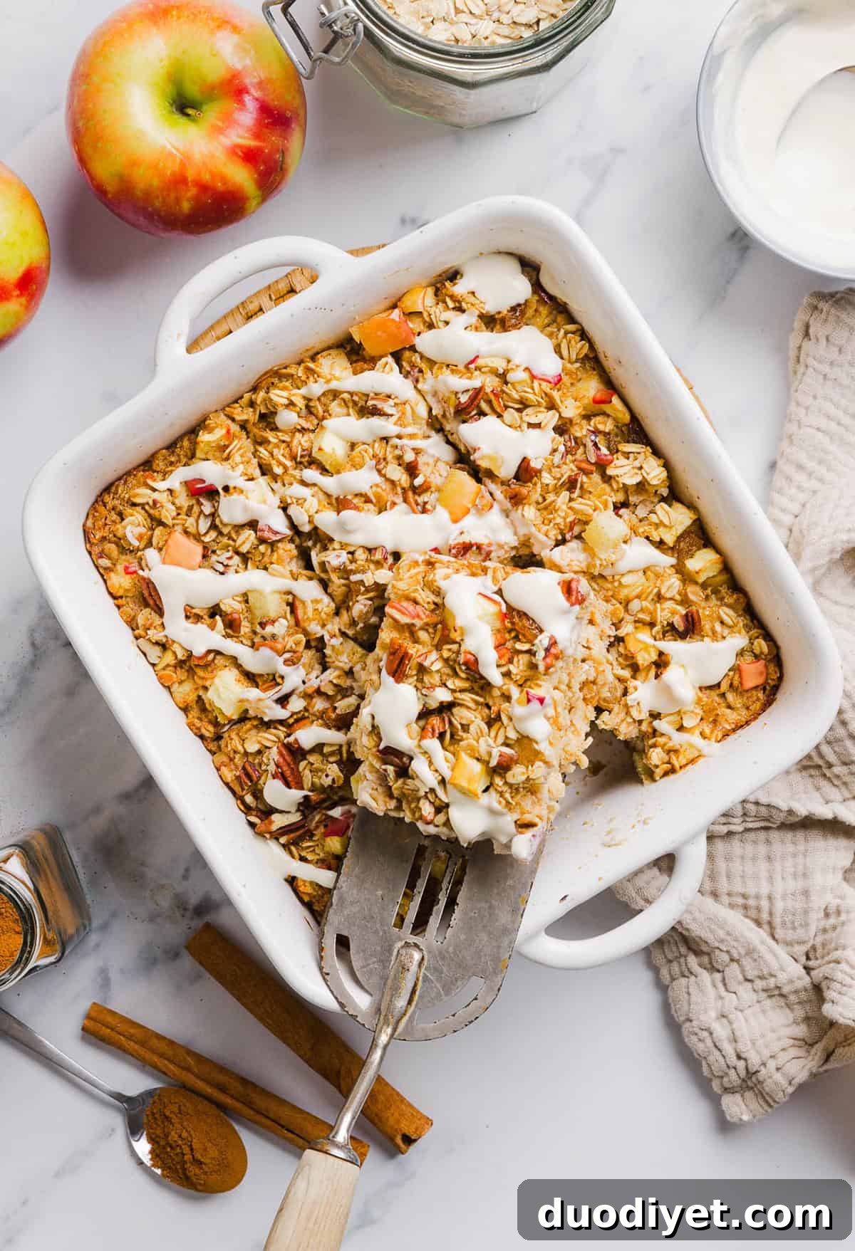 Apple Cinnamon Baked Oatmeal Recipe for Cozy Mornings 5 Portion of apple cinnamon baked oatmeal with glaze