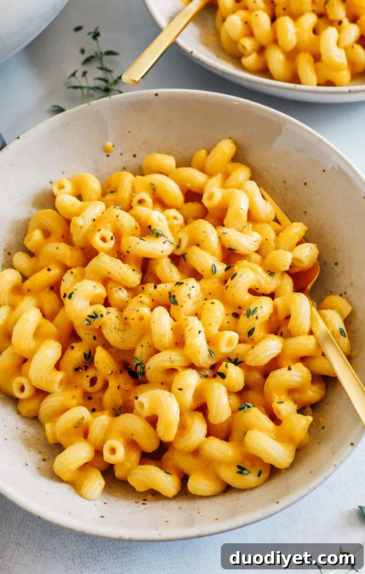 This One Pot Butternut Squash Mac and Cheese is rich, extra creamy, and loaded with so much incredible flavor! Easily made in just 30 minutes for a cozy weeknight dinner the whole family will love!