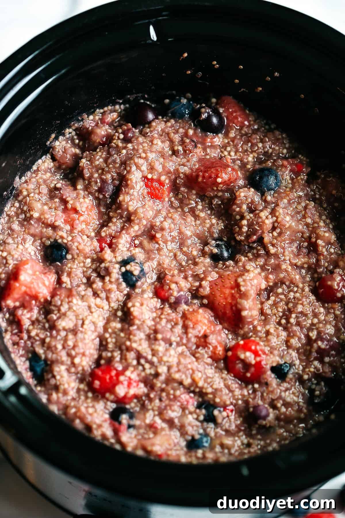 This protein-packed Slow Cooker Berry Breakfast Quinoa is the perfect way to start your mornings and can easily be made by throwing just a few simple ingredients into your crock pot!