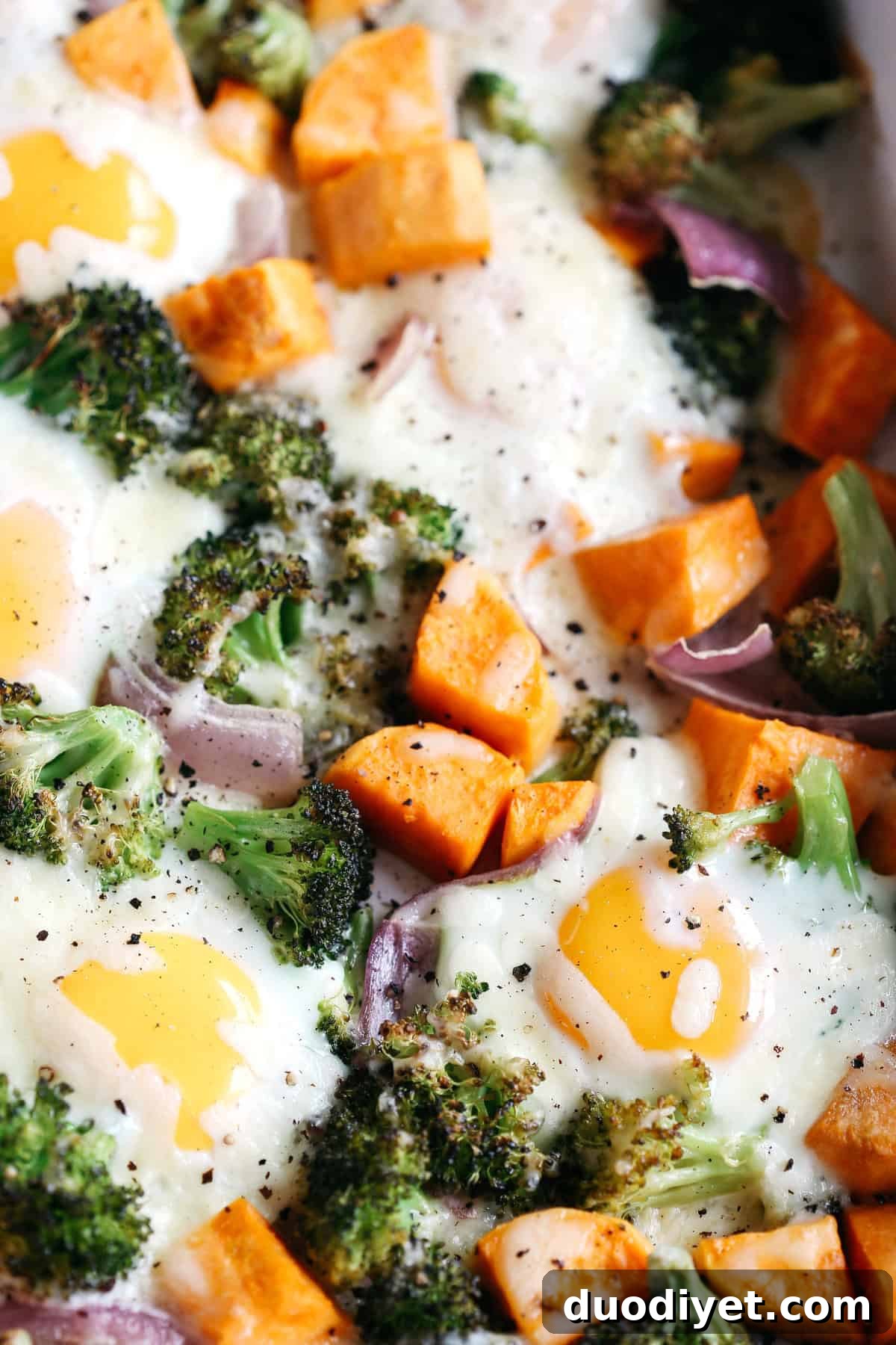 Baked eggs nestled in roasted vegetables