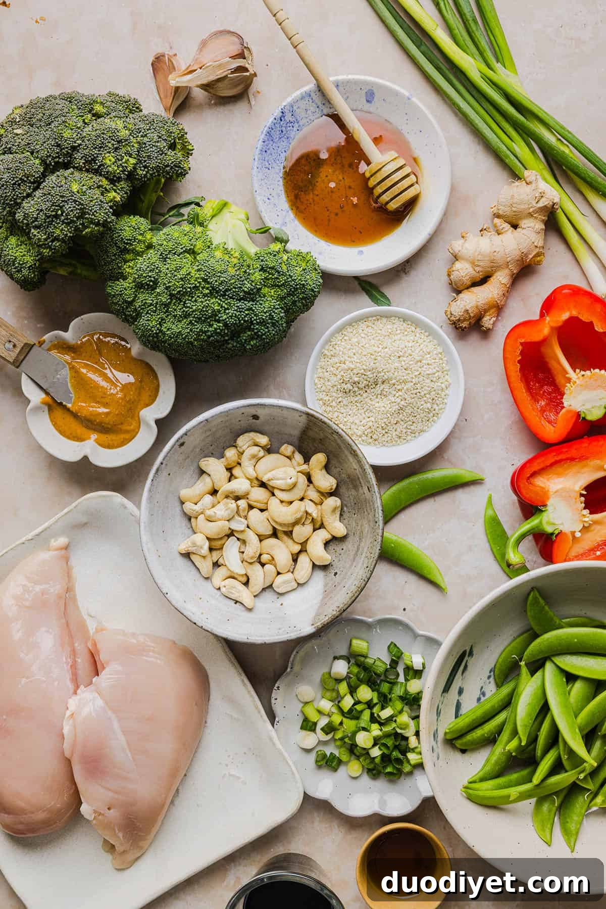 This Healthy Cashew Chicken Stir Fry is the perfect weeknight meal that is quick and easy to make, full of fresh veggies and tossed together in a delicious homemade peanut sauce!