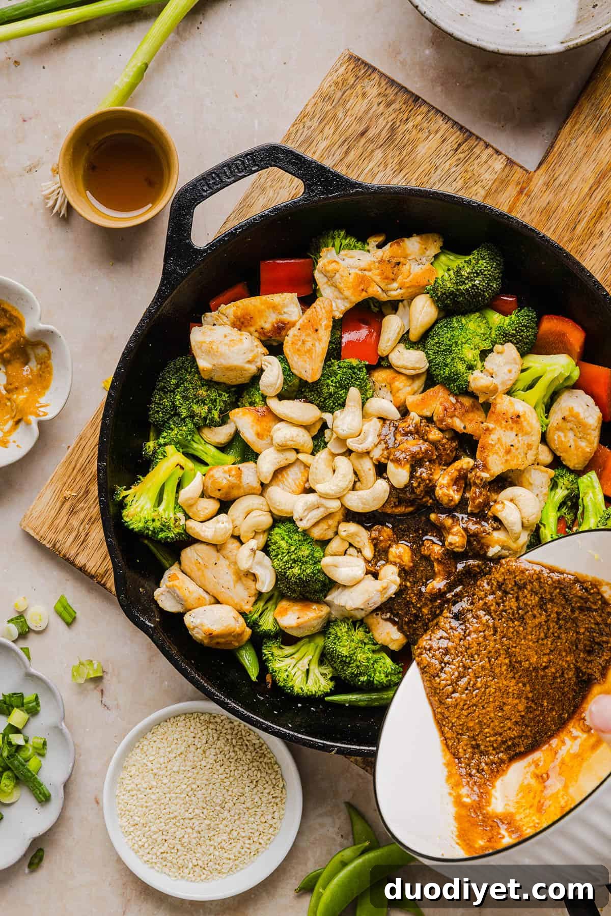 This Healthy Cashew Chicken Stir Fry is the perfect weeknight meal that is quick and easy to make, full of fresh veggies and tossed together in a delicious homemade peanut sauce!