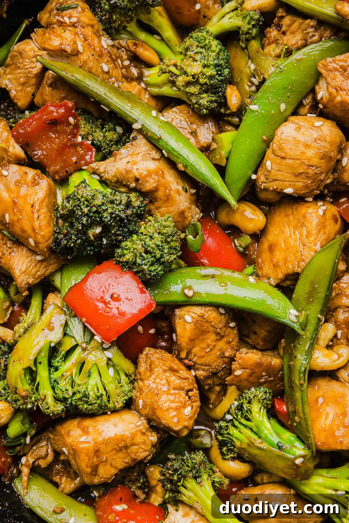 Cashew Chicken Stir-Fry with Vegetables 7 Serving of cashew chicken stir fry garnished with sesame seeds