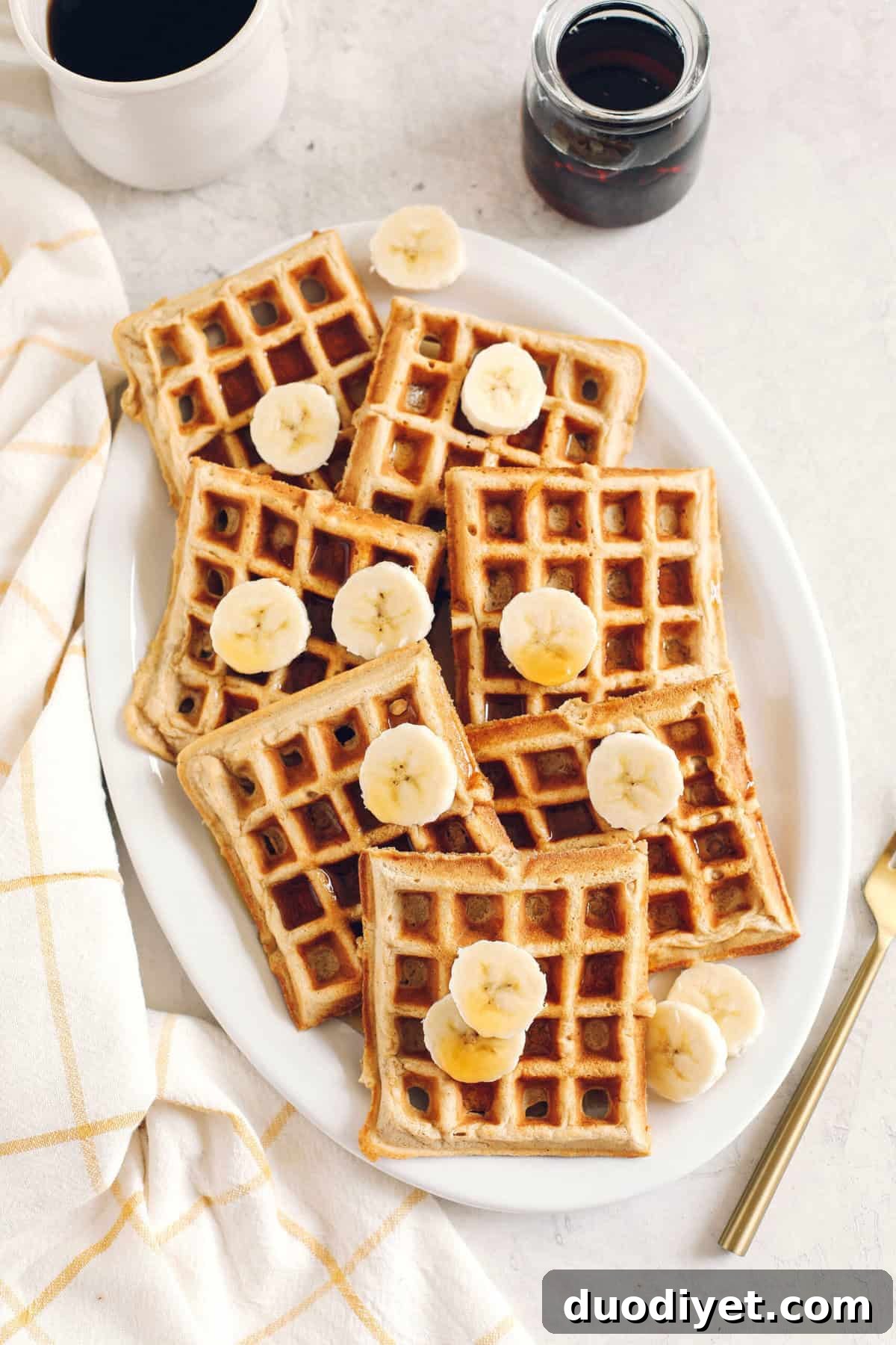 Light and fluffy Whole Wheat Banana Waffles with perfectly crisp edges, warm spices and made with zero refined sugar for the perfect healthy morning breakfast!