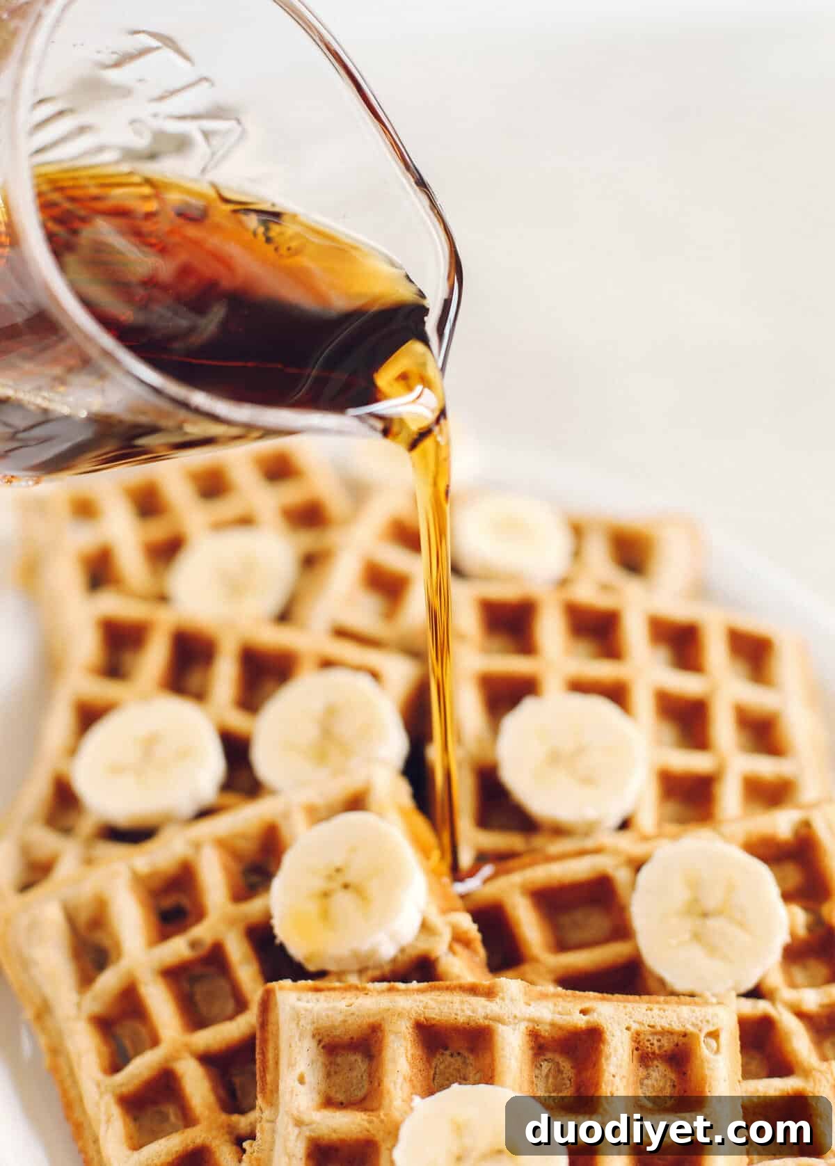 Light and fluffy Whole Wheat Banana Waffles with perfectly crisp edges, warm spices and made with zero refined sugar for the perfect healthy morning breakfast!