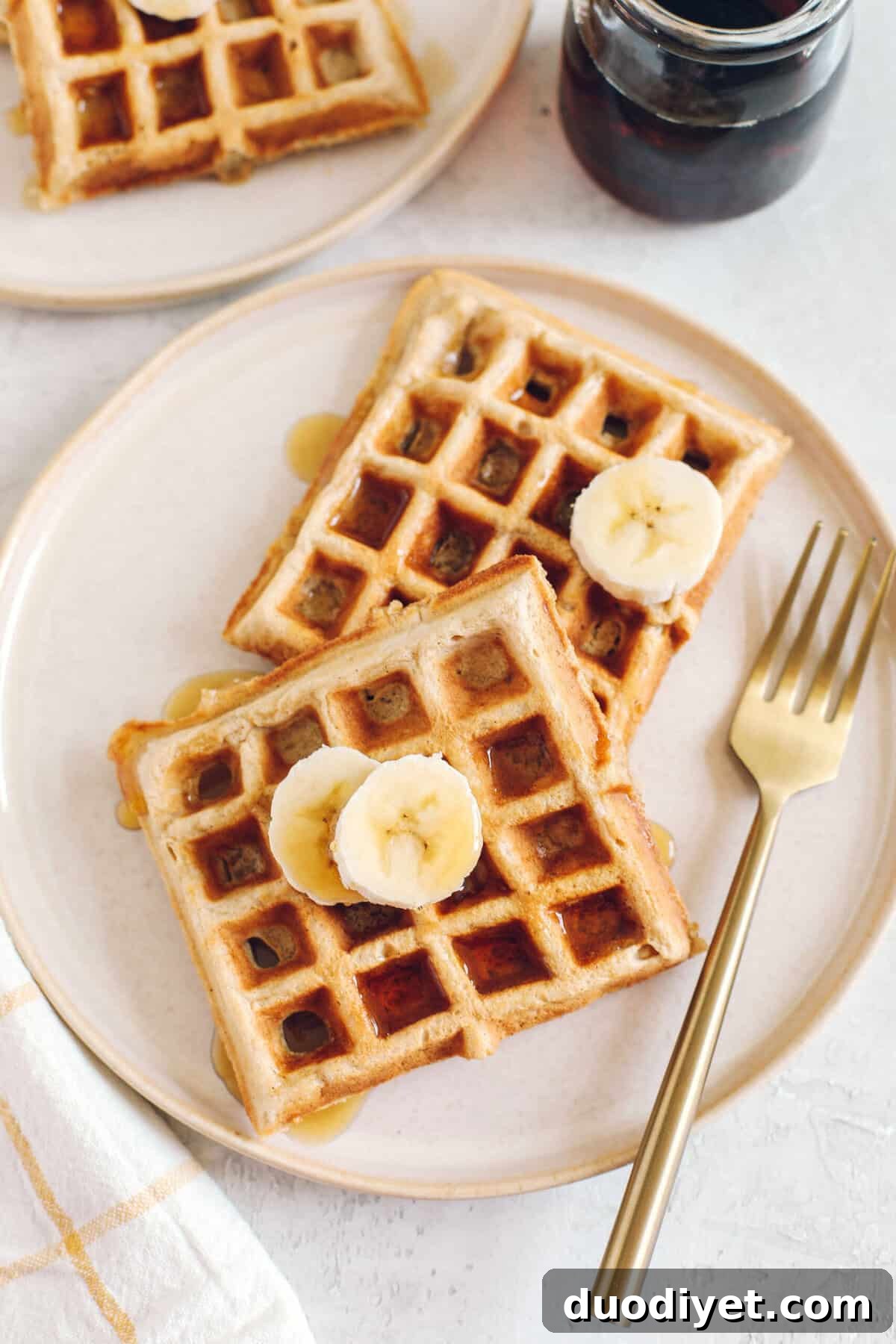 Light and fluffy Whole Wheat Banana Waffles with perfectly crisp edges, warm spices and made with zero refined sugar for the perfect healthy morning breakfast!