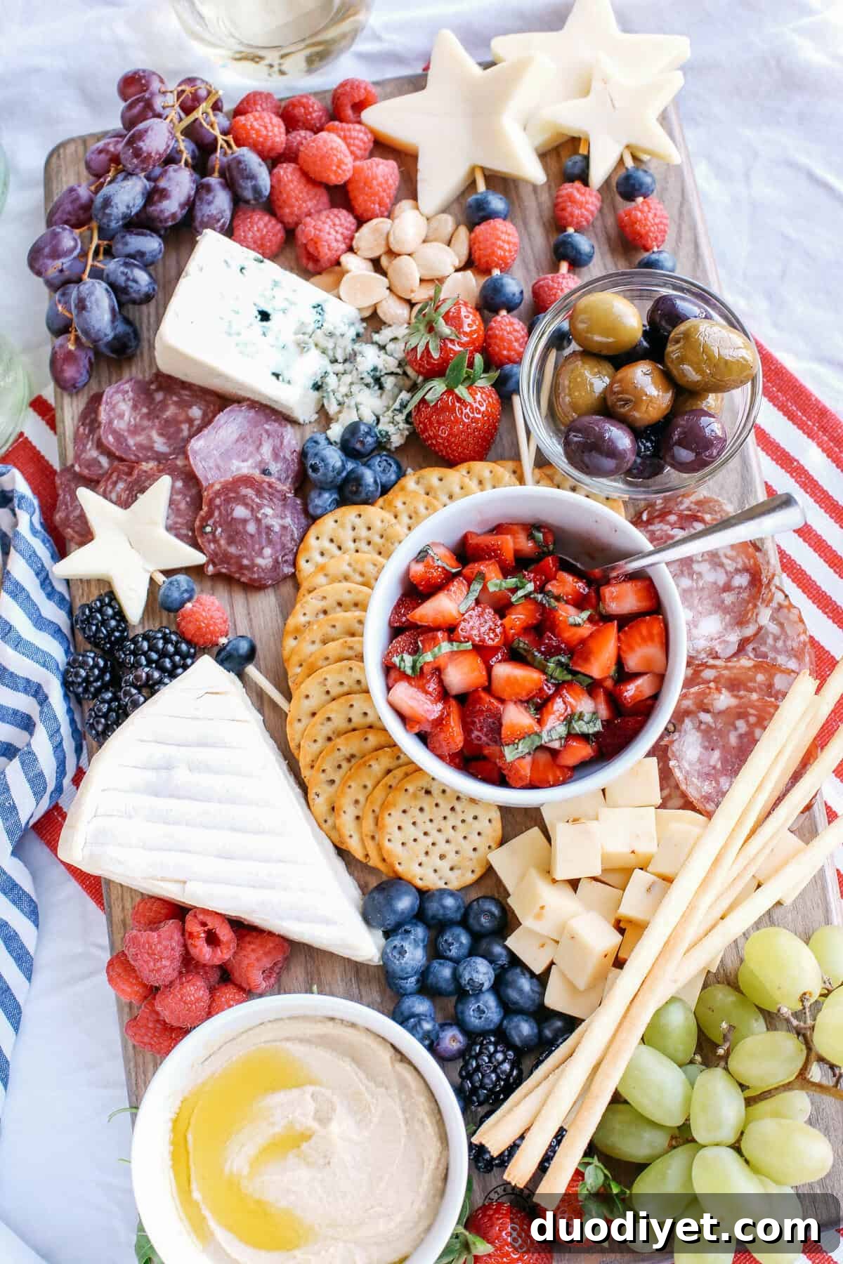 Red, White and Blue Cheese Board for 4th of July 3 A colorful patriotic cheeseboard with red strawberries and blue berries