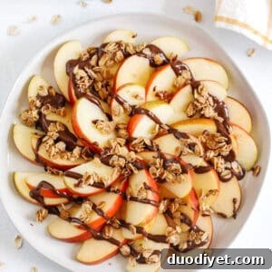 Chocolate-Dipped Apple Wedges with Granola Recipe 4 Small plate of apple wedges topped with chocolate and granola