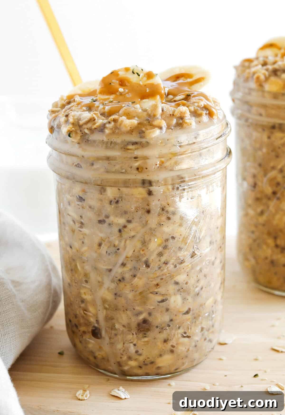 Creamy Peanut Butter Banana Overnight Oats Recipe 4 Jar of peanut butter banana overnight oats with toppings