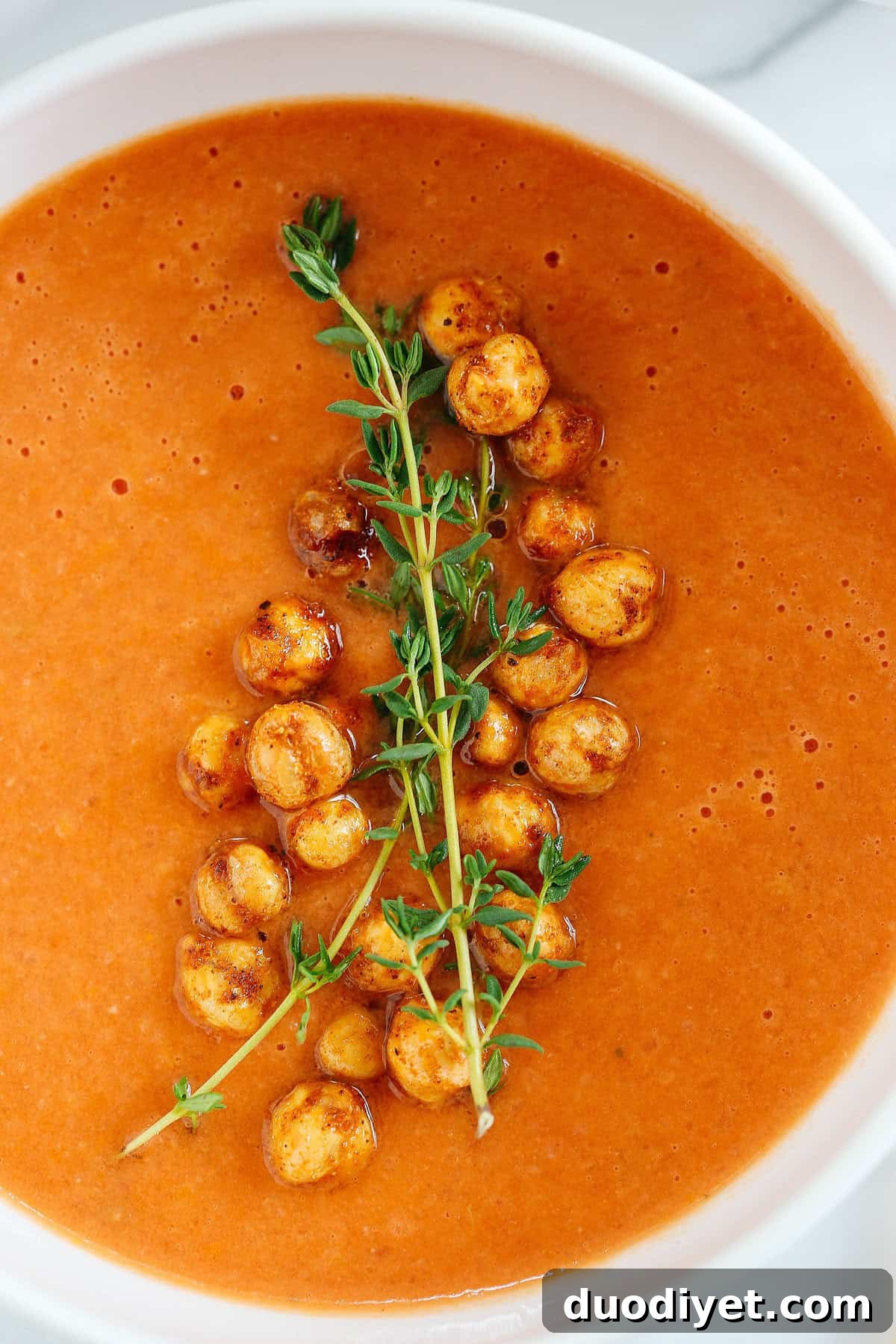 This Creamy Tomato Hummus Detox Soup is the perfect remedy for cold and flu season that is filled with tons of antioxidants and immune-boosting ingredients to keep you healthy all season long!