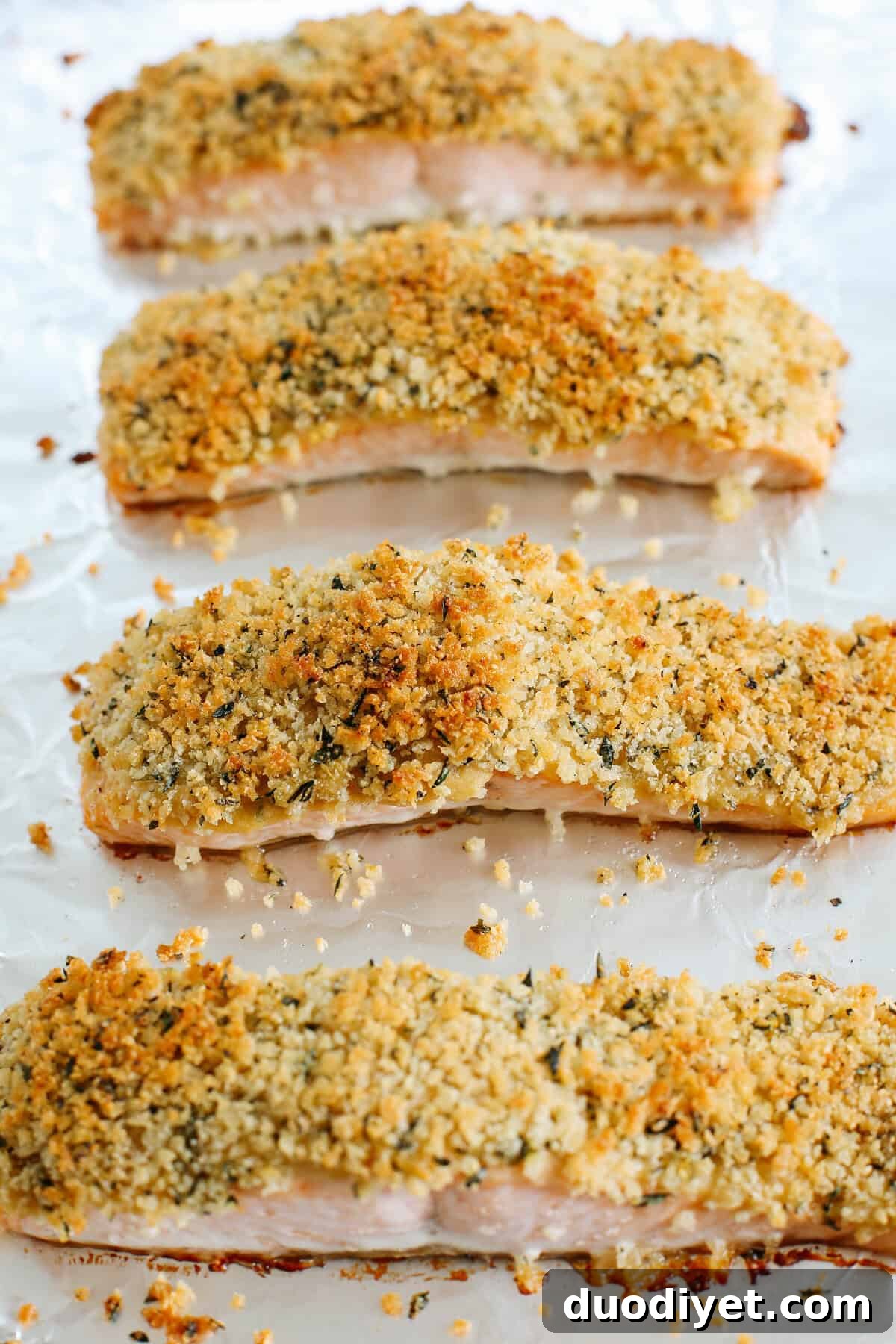 Hummus Crusted Salmon baked to perfection and served with a delicious Lemon Arugula Salad for the perfect healthy weeknight meal ready in under 30 minutes!
