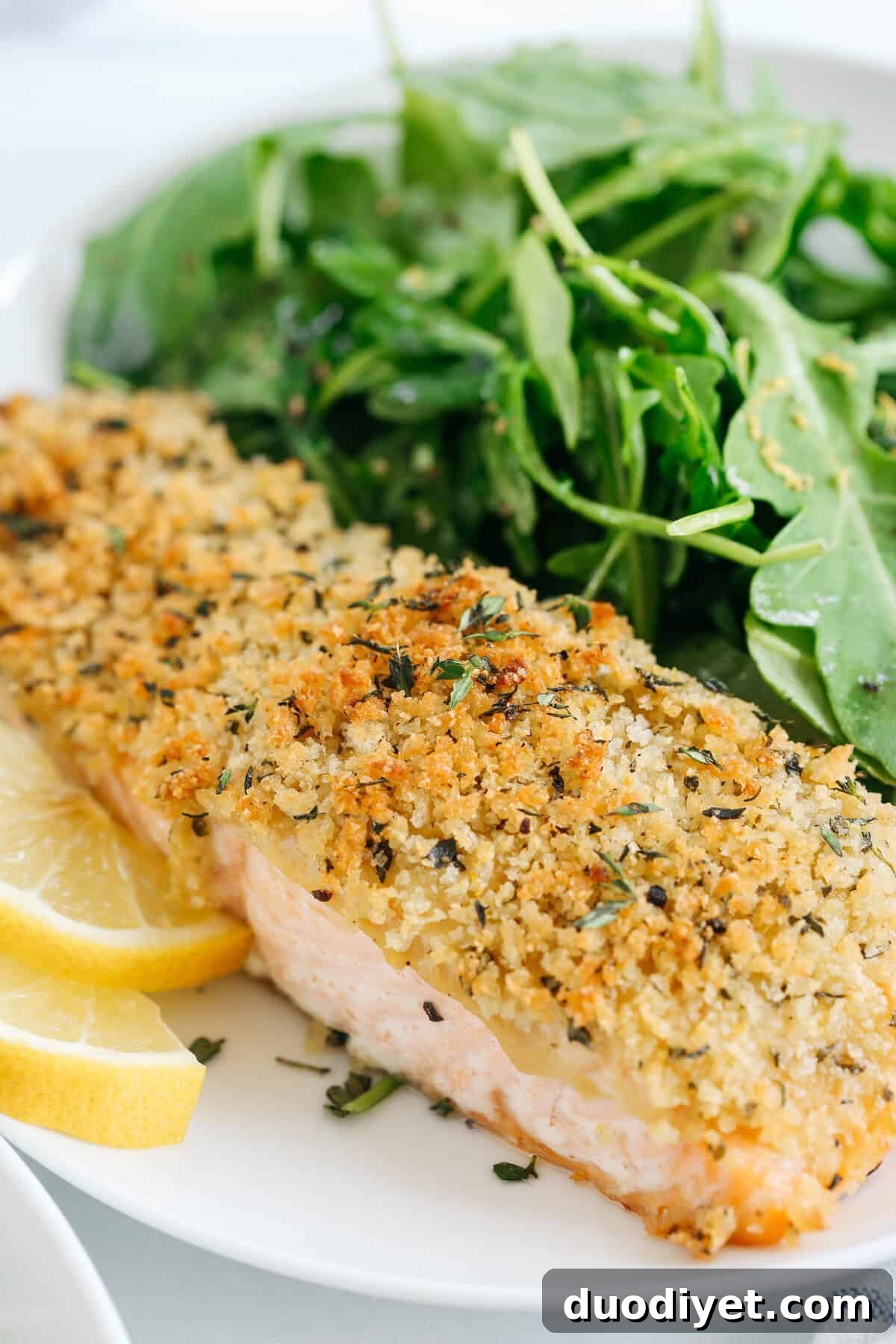 Hummus Crusted Salmon baked to perfection and served with a delicious Lemon Arugula Salad for the perfect healthy weeknight meal ready in under 30 minutes!