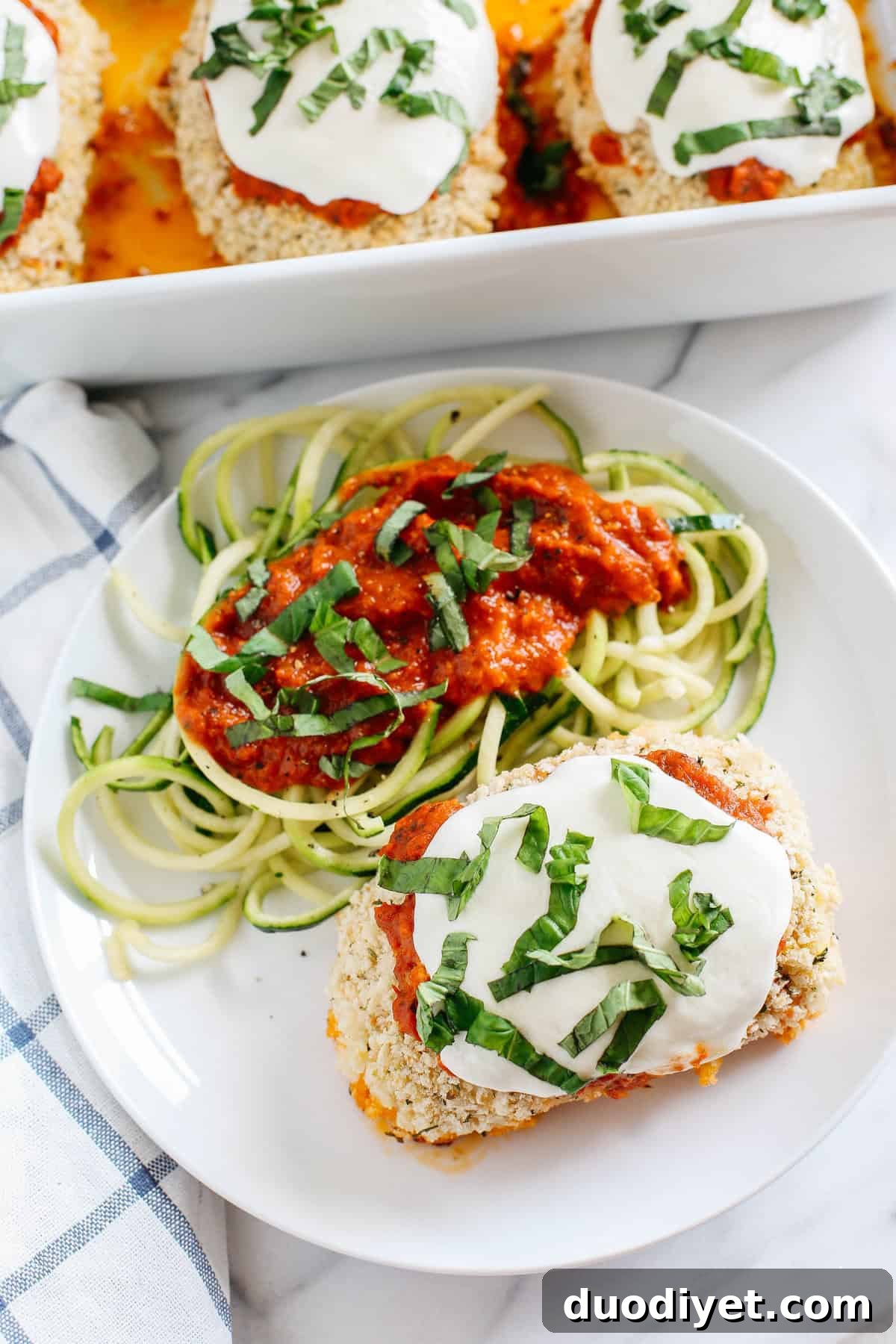 Final plated Sun Dried Tomato Pesto Chicken Rolls with zucchini noodles