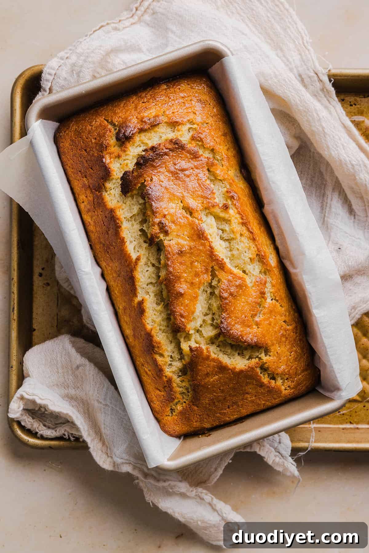 Loaf of banana bread on cutting board