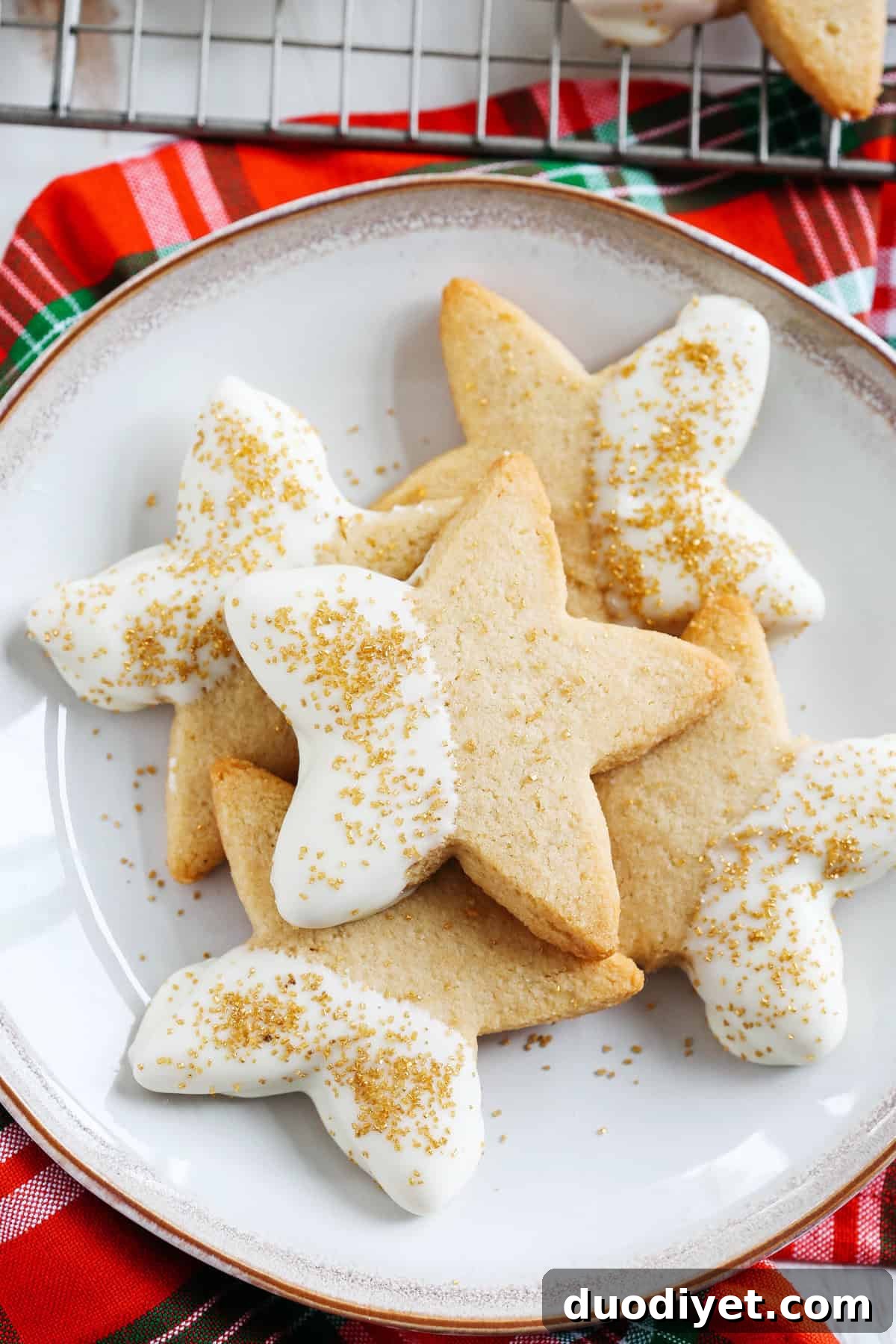 Baked grain-free sugar cookies cooling on a rack