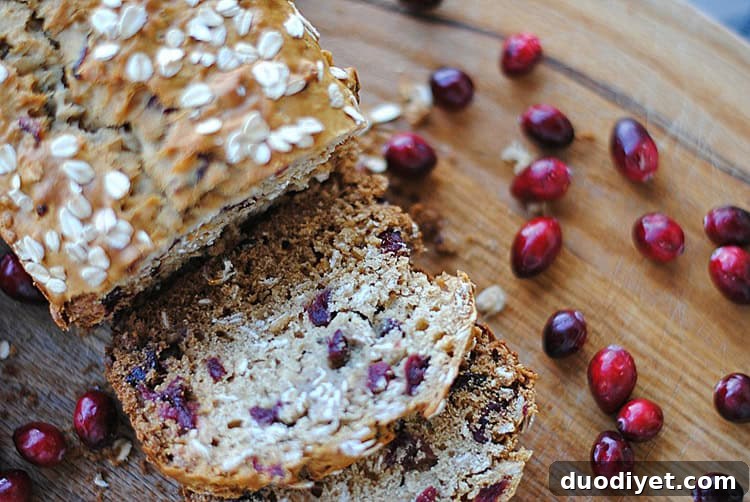 Slice of cranberry oat and honey bread on plate