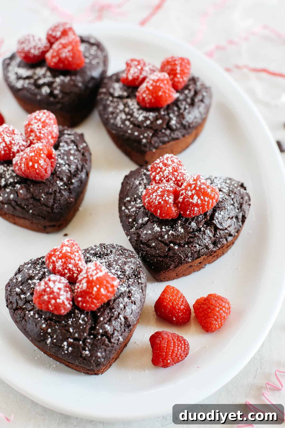 Perfectly portioned Mini Chocolate Cakes with delicious raspberry filling in every bite!  Gluten-free, dairy-free, refined sugar-free and SUPER moist!