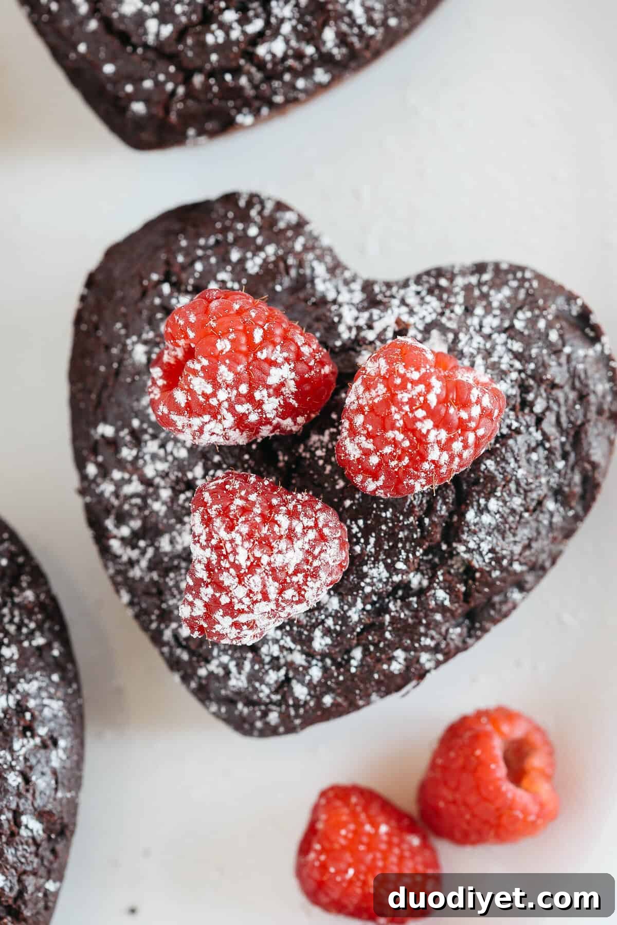 Perfectly portioned Mini Chocolate Cakes with delicious raspberry filling in every bite! Gluten-free, dairy-free, refined sugar-free and SUPER moist!