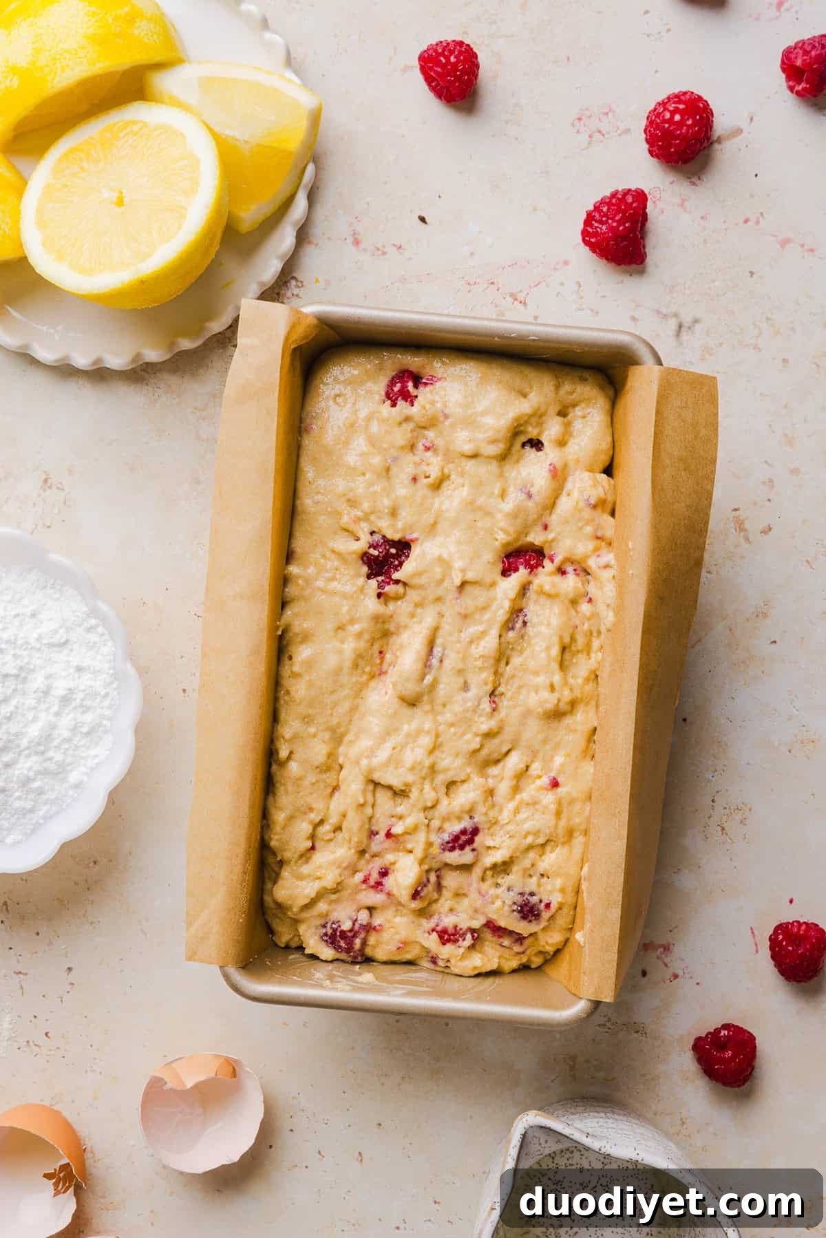 Moist Raspberry Lemon Yogurt Loaf Recipe 5 Close-up of bread texture with raspberries