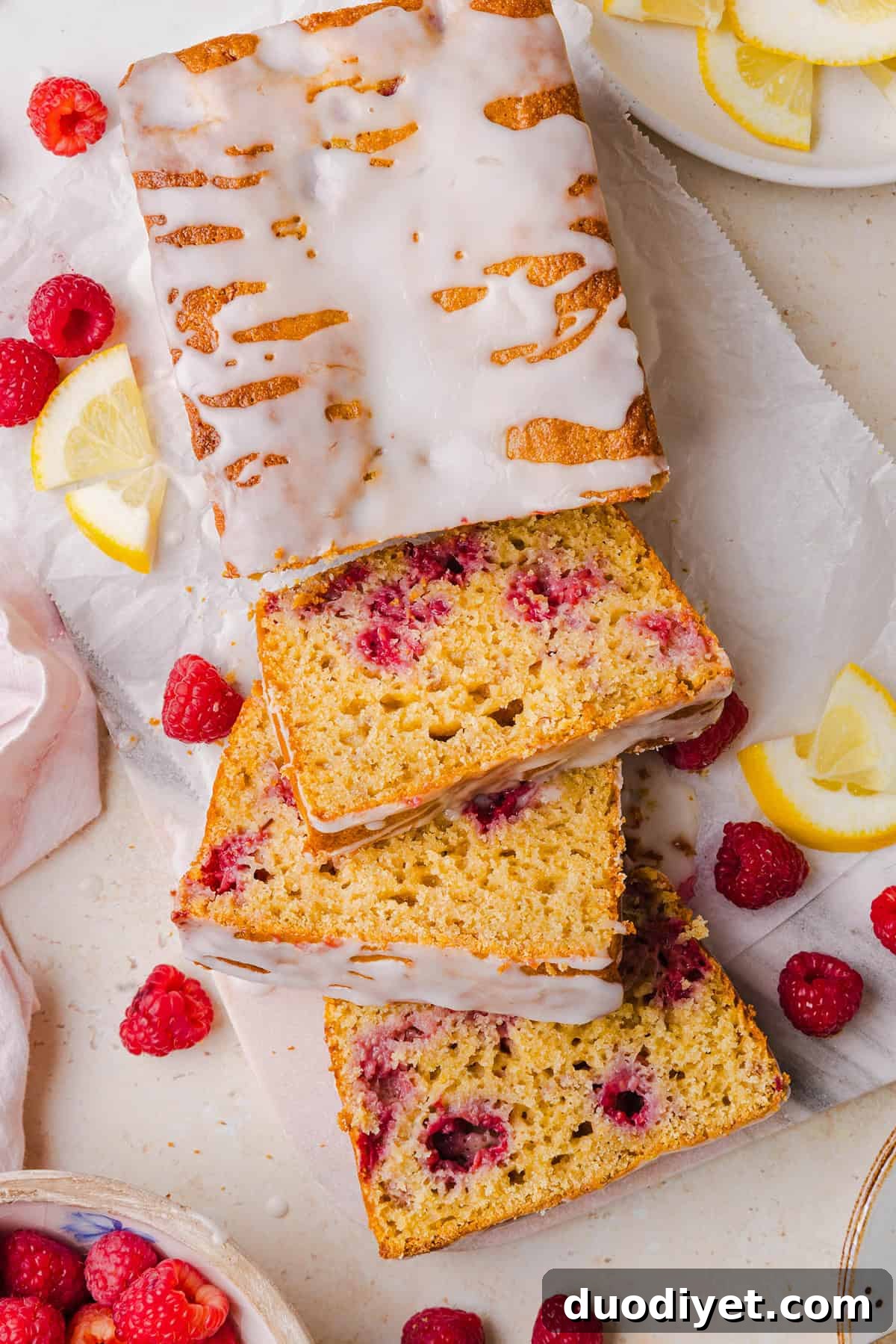 Moist Raspberry Lemon Yogurt Loaf Recipe 7 Slice of Raspberry Lemon Yogurt Bread on plate