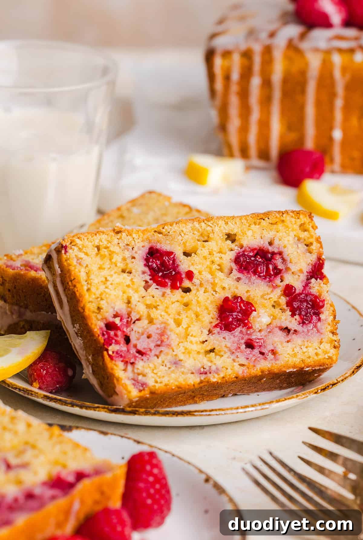 Moist Raspberry Lemon Yogurt Loaf Recipe 9 Raspberry Lemon Yogurt Bread on a plate