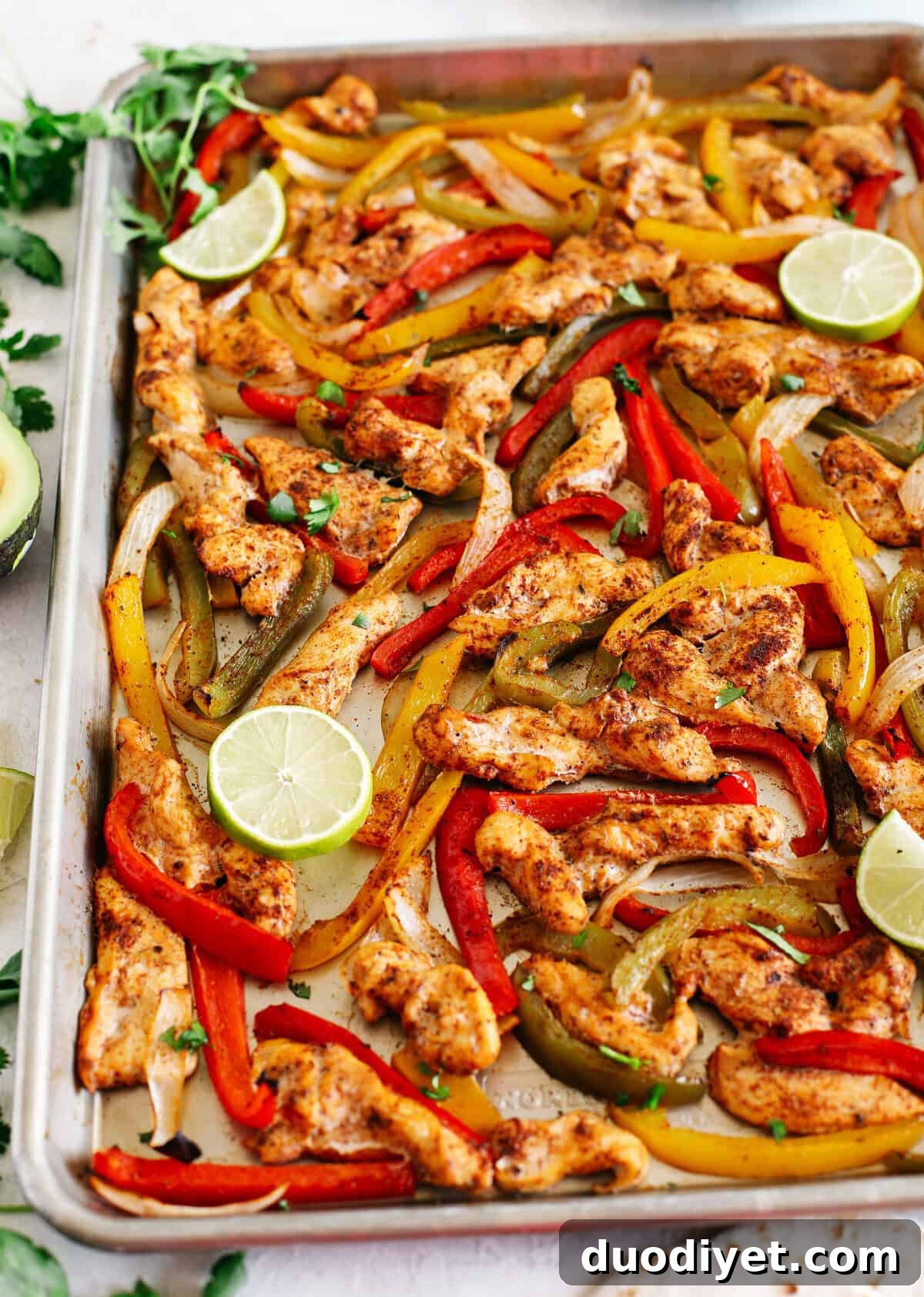 EASY Sheet Pan Chicken Fajitas with all your favorite Mexican flavors that makes the perfect healthy weeknight dinner easily made all on one pan in under 30 minutes! Perfect recipe for your Sunday meal prep too!