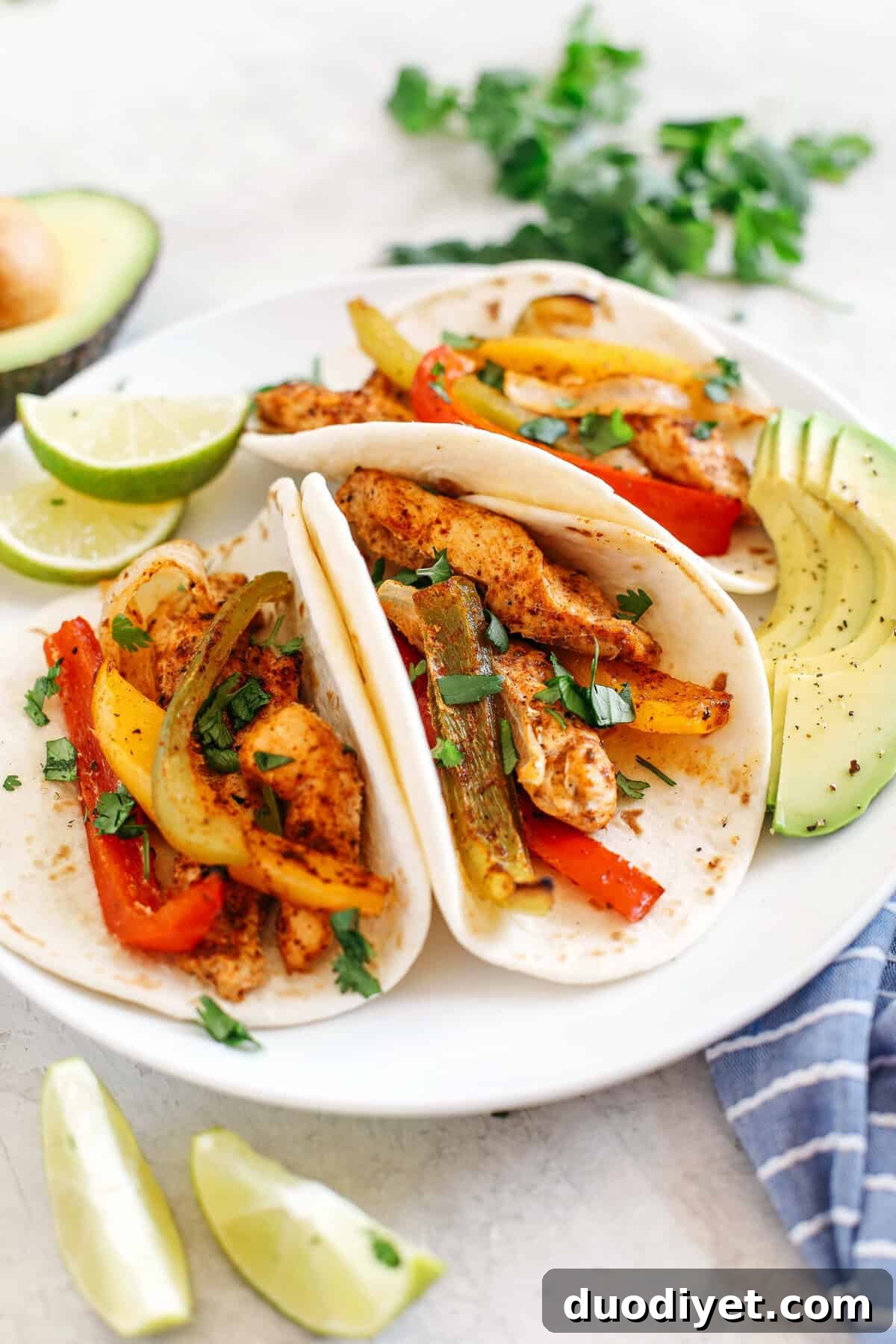 Sheet Pan Chicken Fajitas Recipe with Peppers and Onions 4 Finished Sheet Pan Chicken Fajitas plated and ready to eat