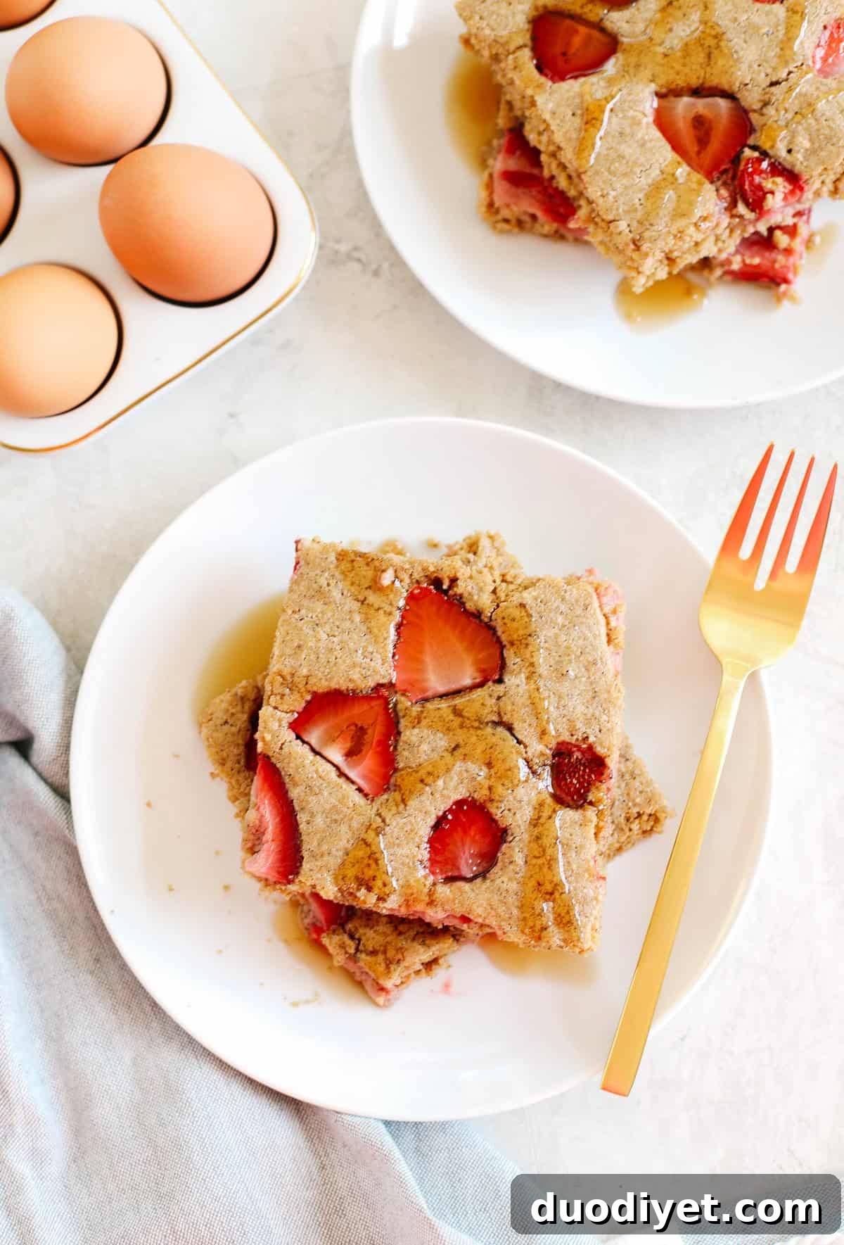 Sheet Pan Strawberry Pancakes Recipe 5 Close up of sheet pan pancakes topped with strawberries