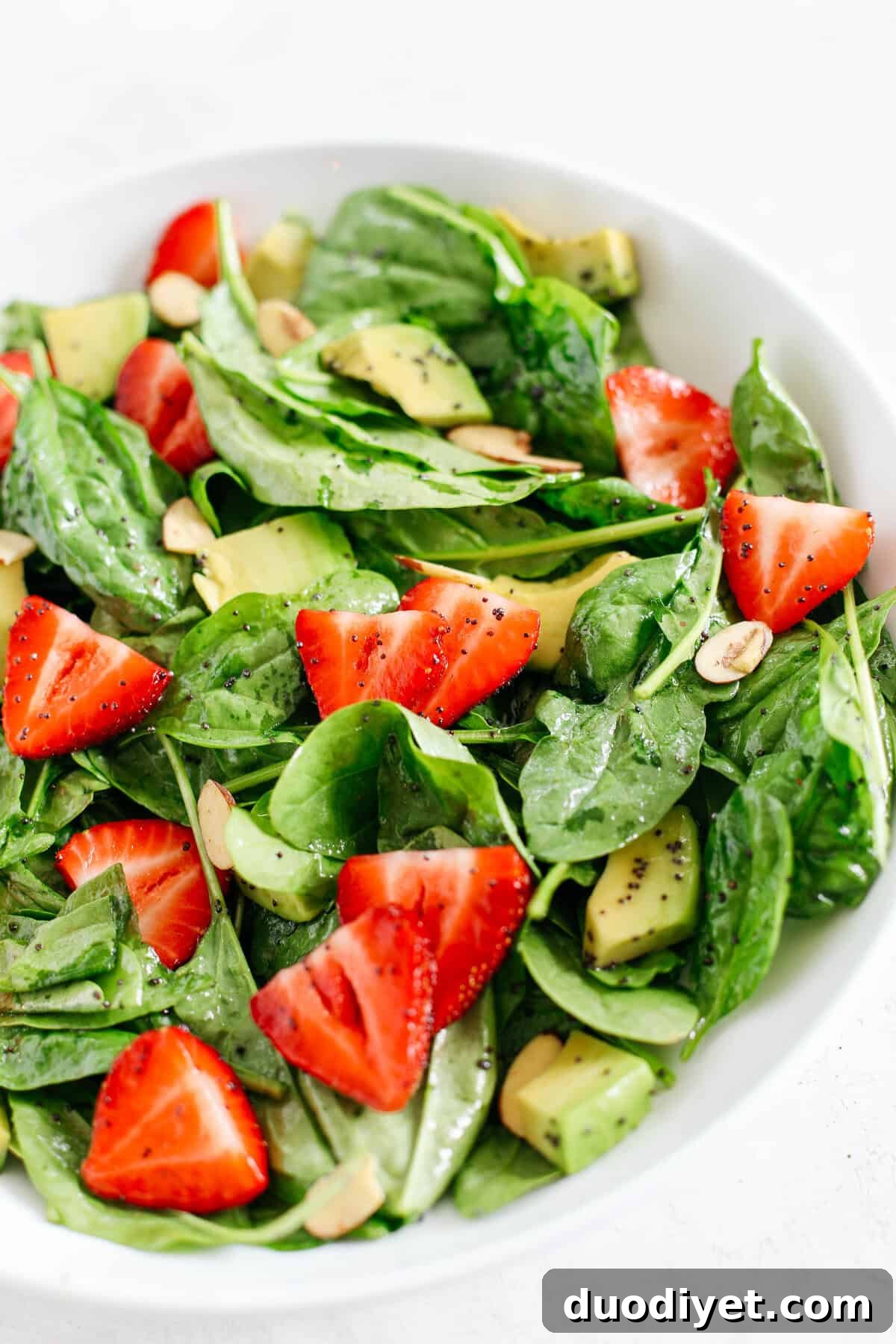 Strawberry spinach salad with poppy seed dressing