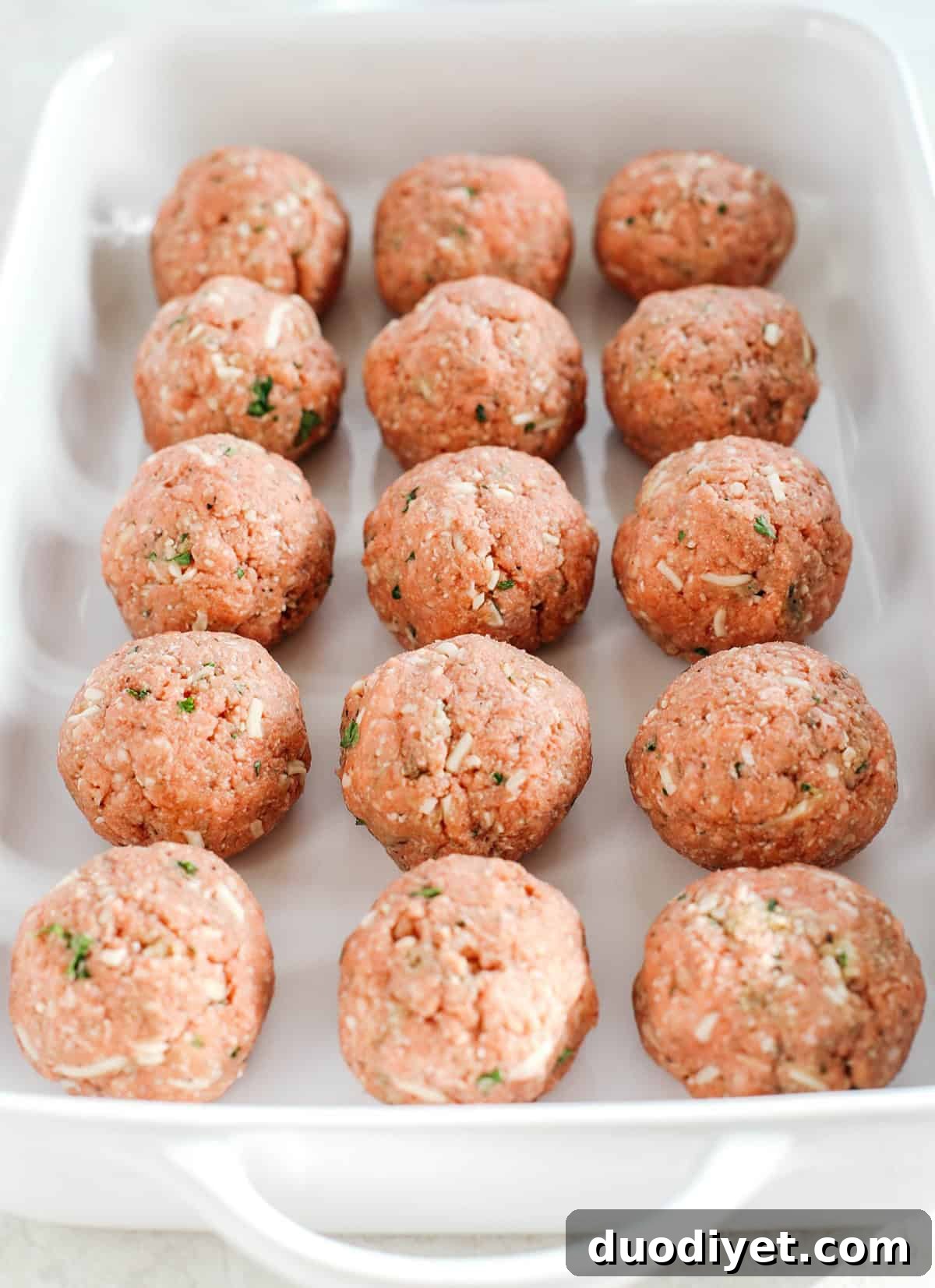 This Cheesy Keto Meatball Casserole is delicious and super filling! Made with homemade meatballs topped with creamy ricotta cheese, mozzarella and parmesan for the perfect low carb meal your whole family will enjoy!