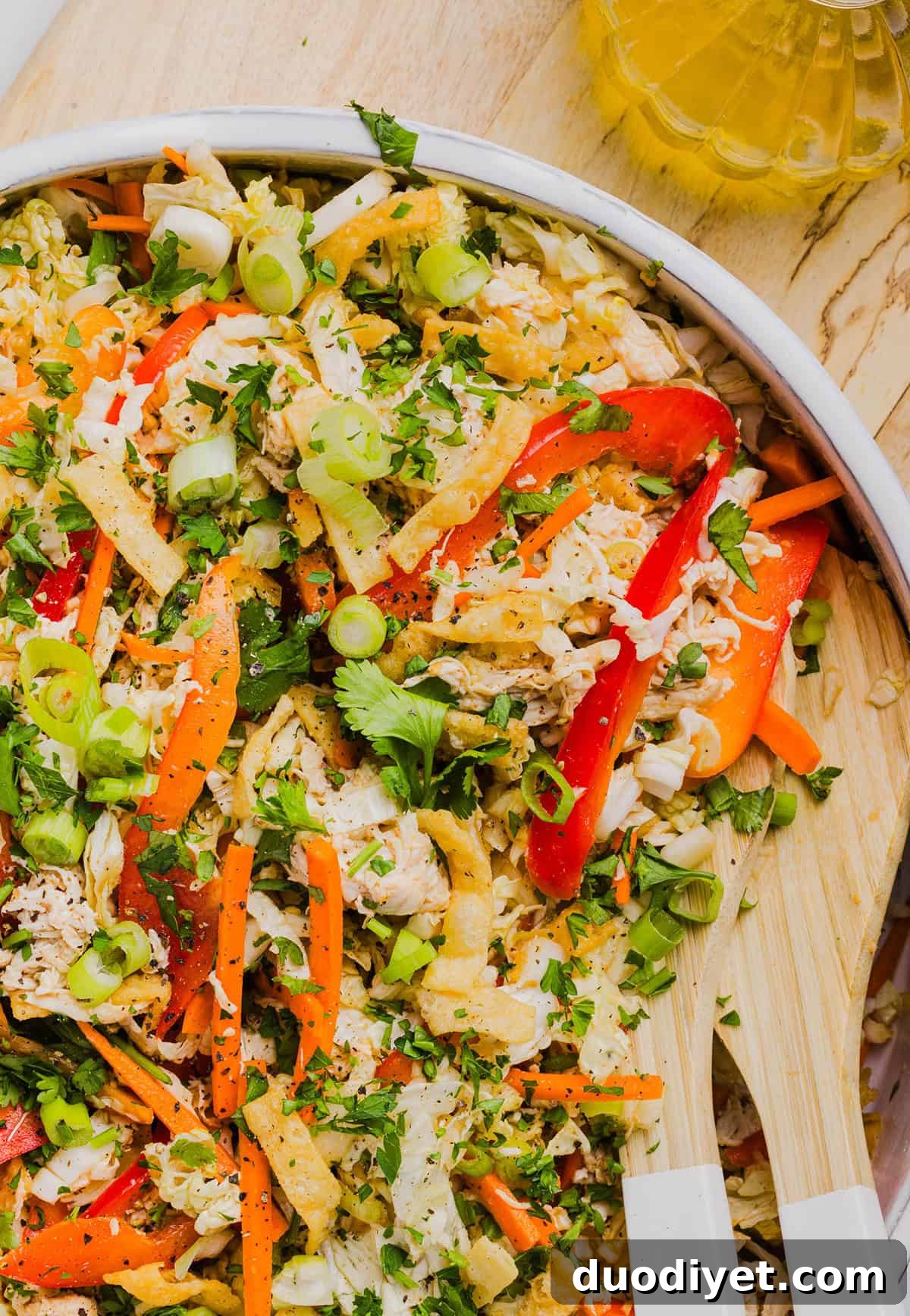 Crunchy Thai Chicken Salad Recipe with Peanut-Lime Dressing 2 Fresh and crunchy Thai Chicken Salad filled with cabbage, bell peppers, carrots and cilantro all tossed together with a delicious ginger-sesame vinaigrette!