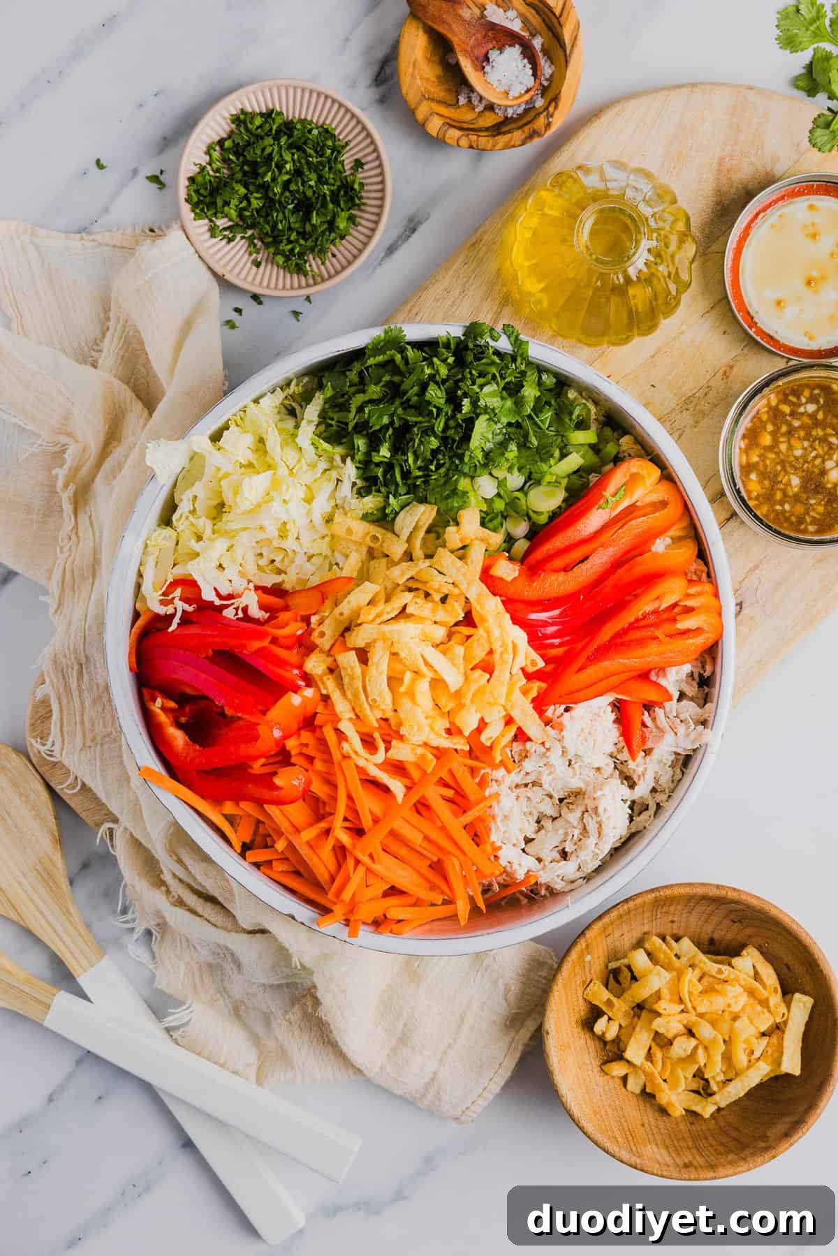 Fresh and crunchy Thai Chicken Salad filled with cabbage, bell peppers, carrots and cilantro all tossed together with a delicious ginger-sesame vinaigrette!
