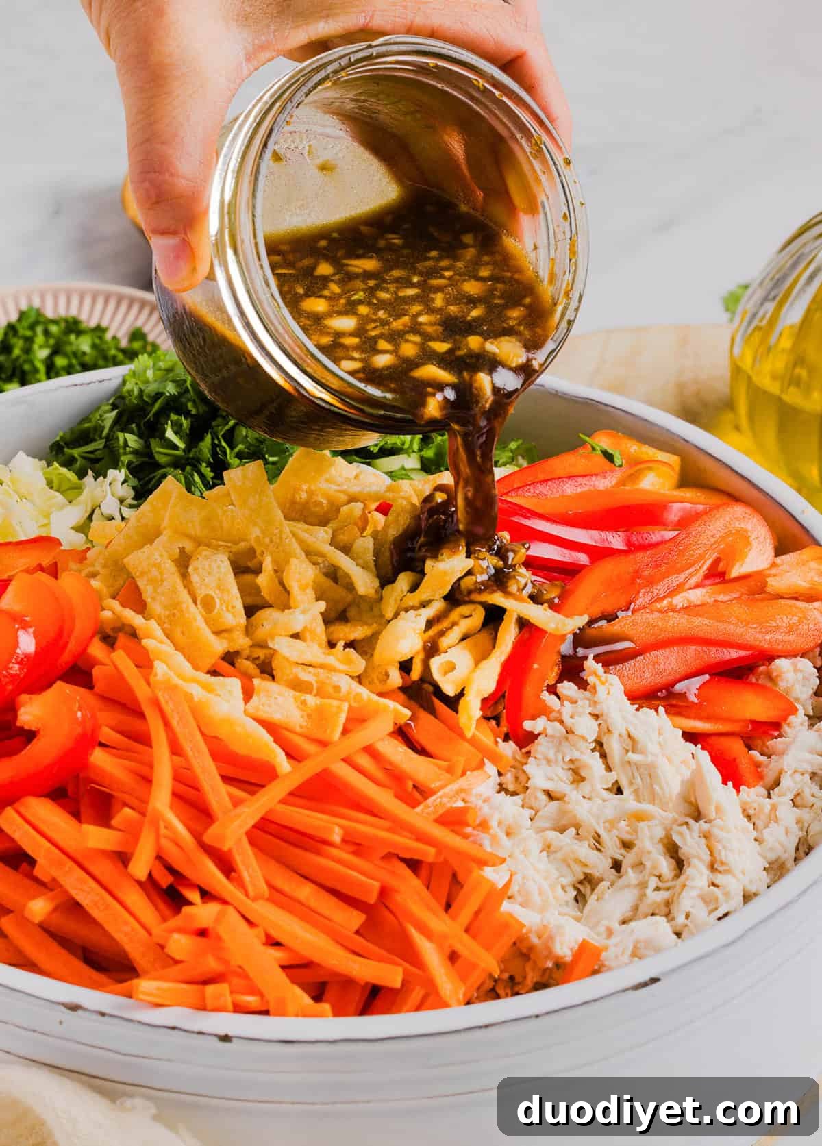 Crunchy Thai Chicken Salad Recipe with Peanut-Lime Dressing 5 Fresh and crunchy Thai Chicken Salad filled with cabbage, bell peppers, carrots and cilantro all tossed together with a delicious ginger-sesame vinaigrette!