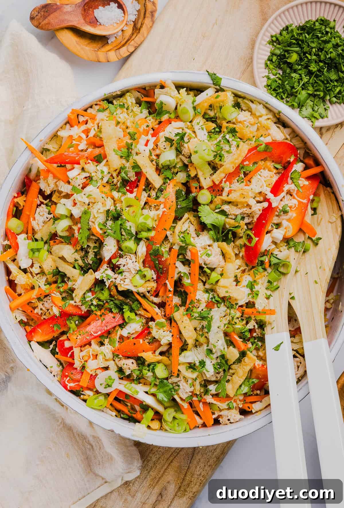 Fresh and crunchy Thai Chicken Salad filled with cabbage, bell peppers, carrots and cilantro all tossed together with a delicious ginger-sesame vinaigrette!