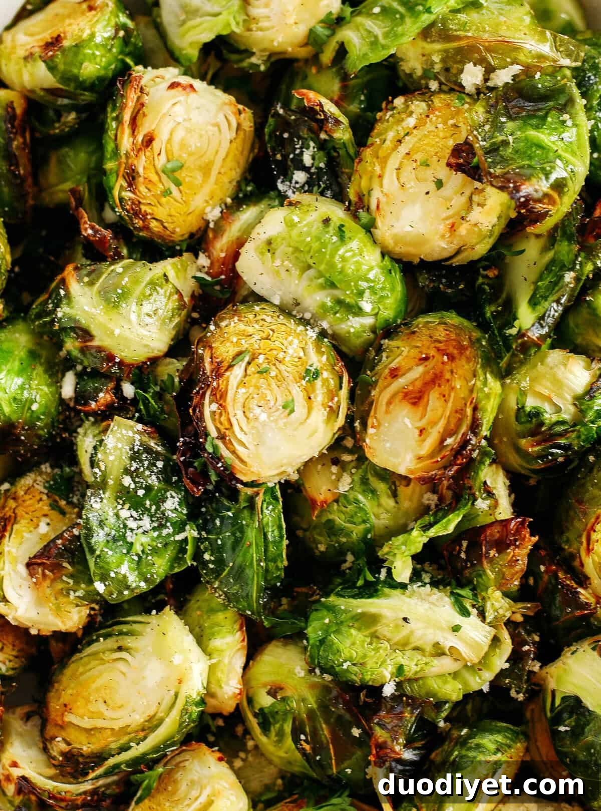 Crispy Garlic Parmesan Brussels Sprouts easily cooked in your air fryer in just 15 minutes for a delicious healthy snack or side dish!