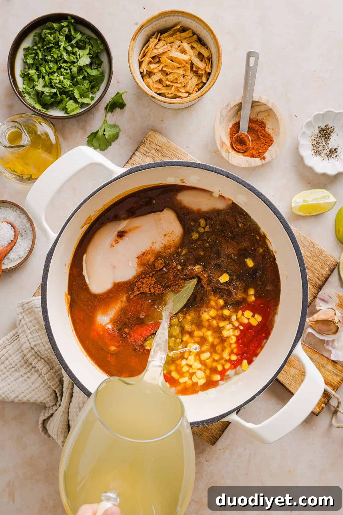 This Easy Chicken Tortilla Soup makes the perfect weeknight meal that can easily be made right in your instant pot, slow cooker or on the stove! Packed with tender shredded chicken, veggies, beans and all the toppings for a delicious, flavor-packed meal!
