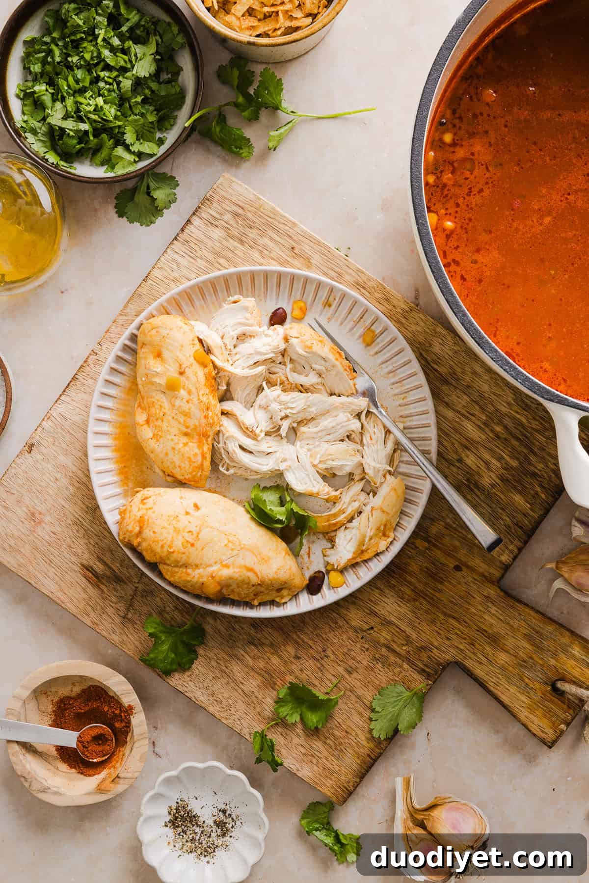 This Easy Chicken Tortilla Soup makes the perfect weeknight meal that can easily be made right in your instant pot, slow cooker or on the stove! Packed with tender shredded chicken, veggies, beans and all the toppings for a delicious, flavor-packed meal!