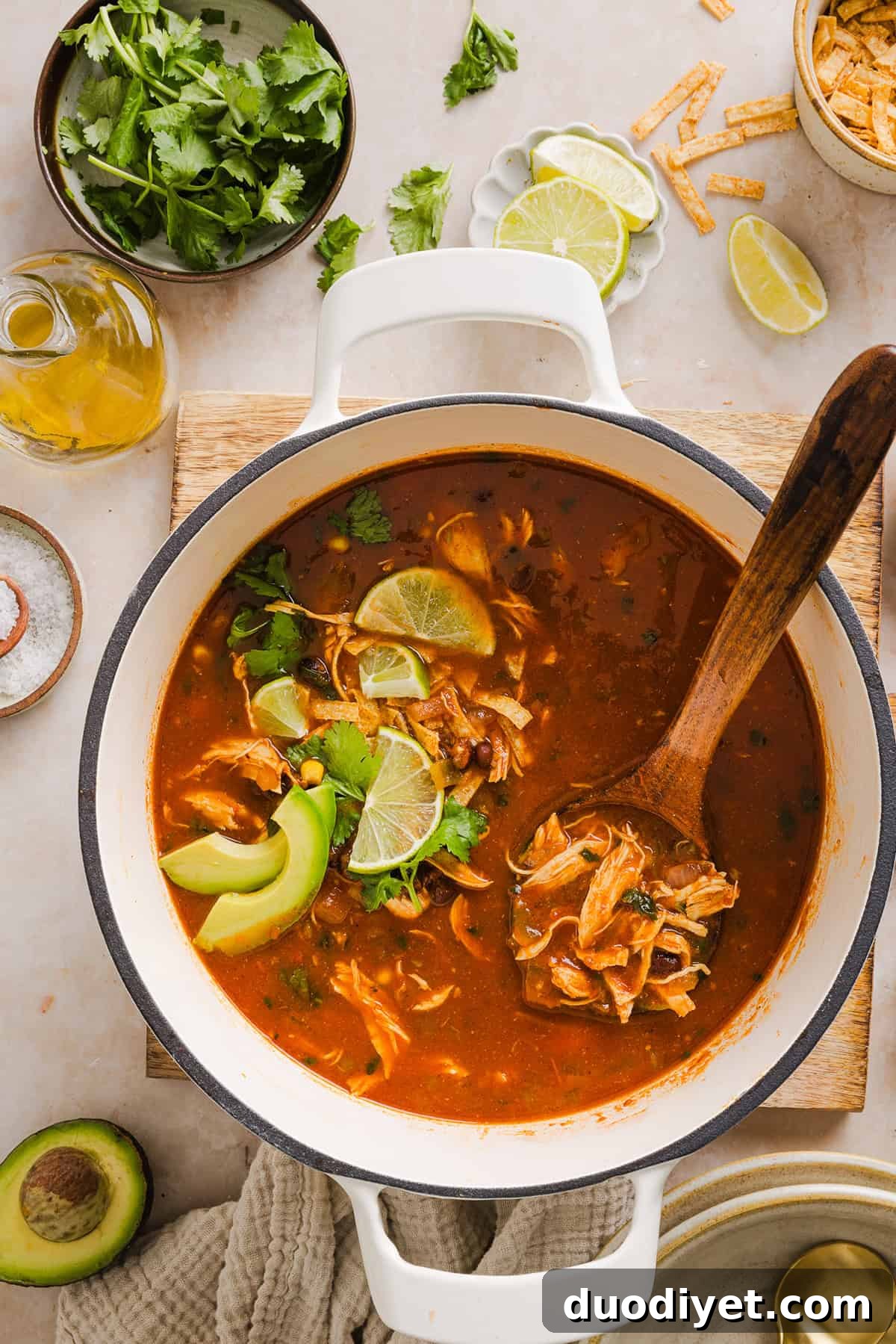 This Easy Chicken Tortilla Soup makes the perfect weeknight meal that can easily be made right in your instant pot, slow cooker or on the stove! Packed with tender shredded chicken, veggies, beans and all the toppings for a delicious, flavor-packed meal!