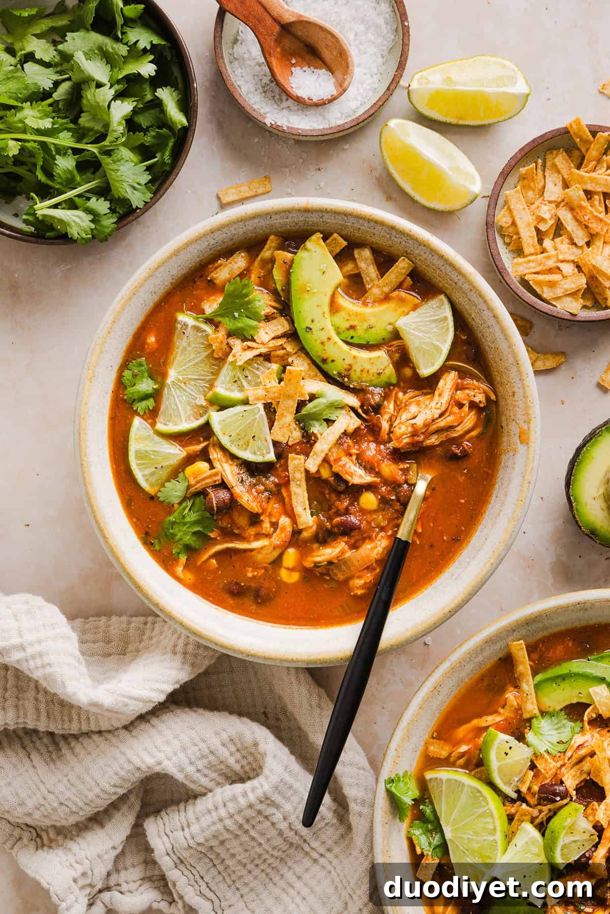 This Easy Chicken Tortilla Soup makes the perfect weeknight meal that can easily be made right in your instant pot, slow cooker or on the stove! Packed with tender shredded chicken, veggies, beans and all the toppings for a delicious, flavor-packed meal!