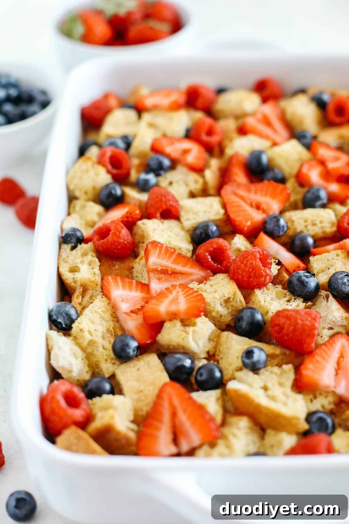 Warm and flavorful Mixed Berry French Toast Casserole with a delicious cream cheese drizzle that can easily be made the night before for the perfect morning breakfast!